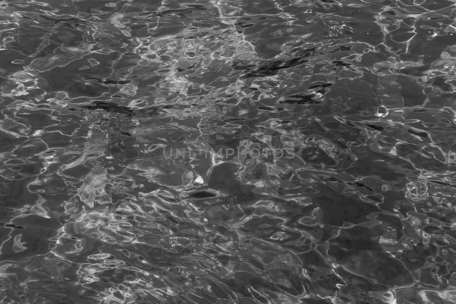 grey abstract background of wavy water surface