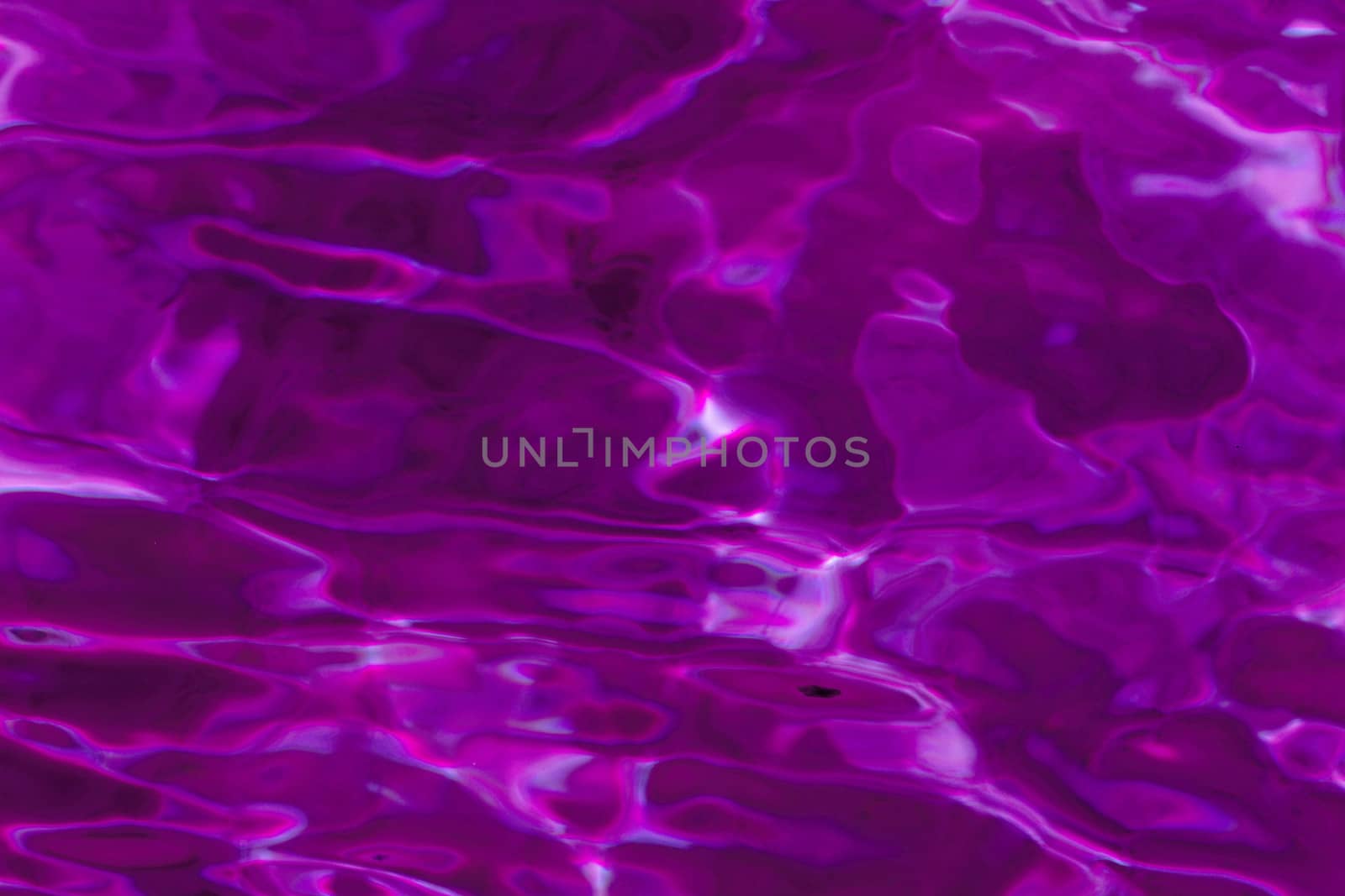 purple abstract background of wavy water surface (lilac)