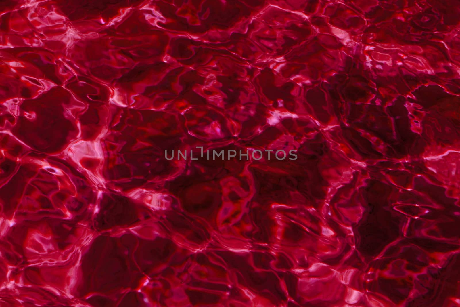 red abstract background of wavy water surface