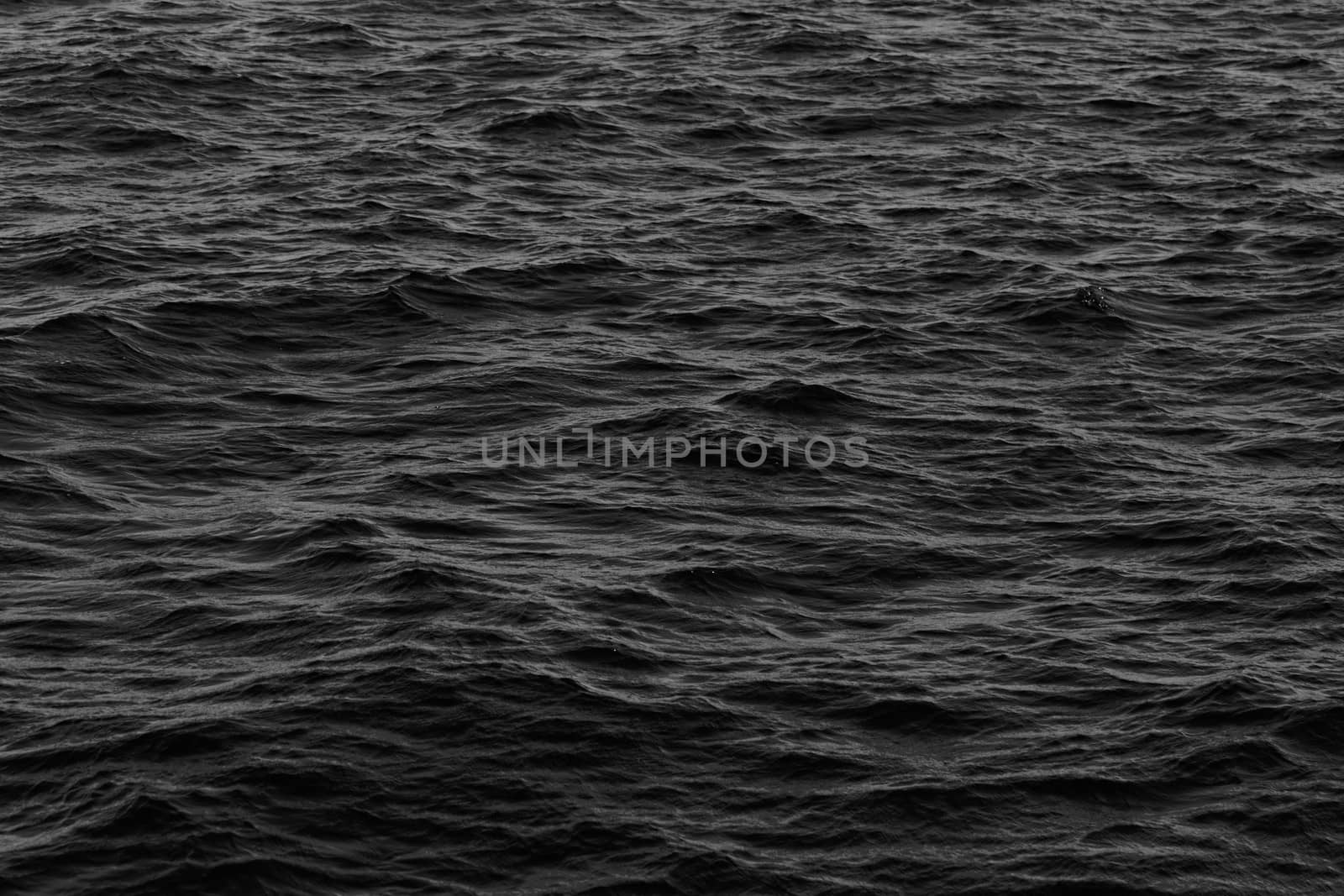 grey abstract background of wavy water surface