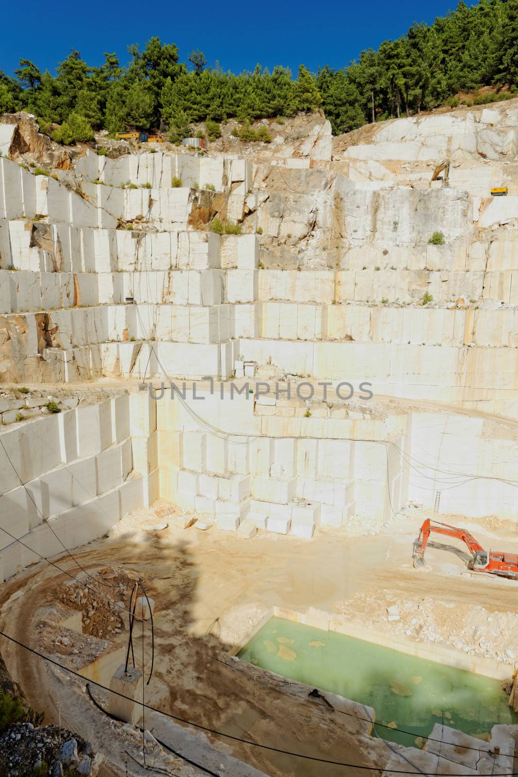 Detail of huge Thassos white marble quarry (mine) with grabber