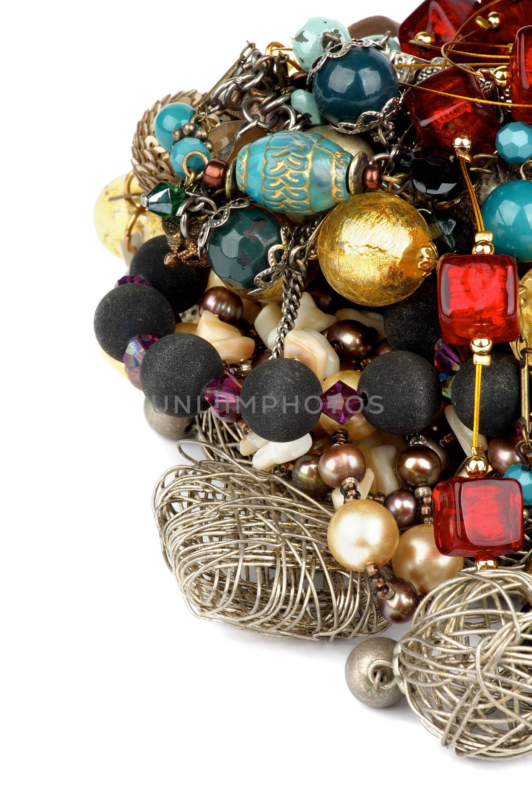 Arrangement of Jewelry with Gold Bracelets, Ruby Necklace, Pearl and Gem Beads closeup on white background