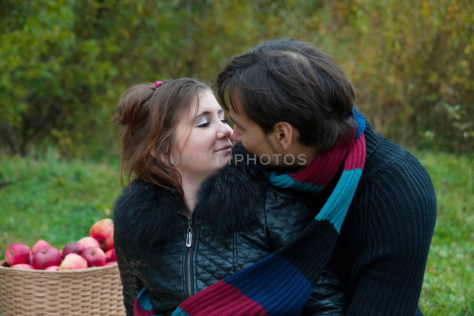 young couple embracing in autumn nature