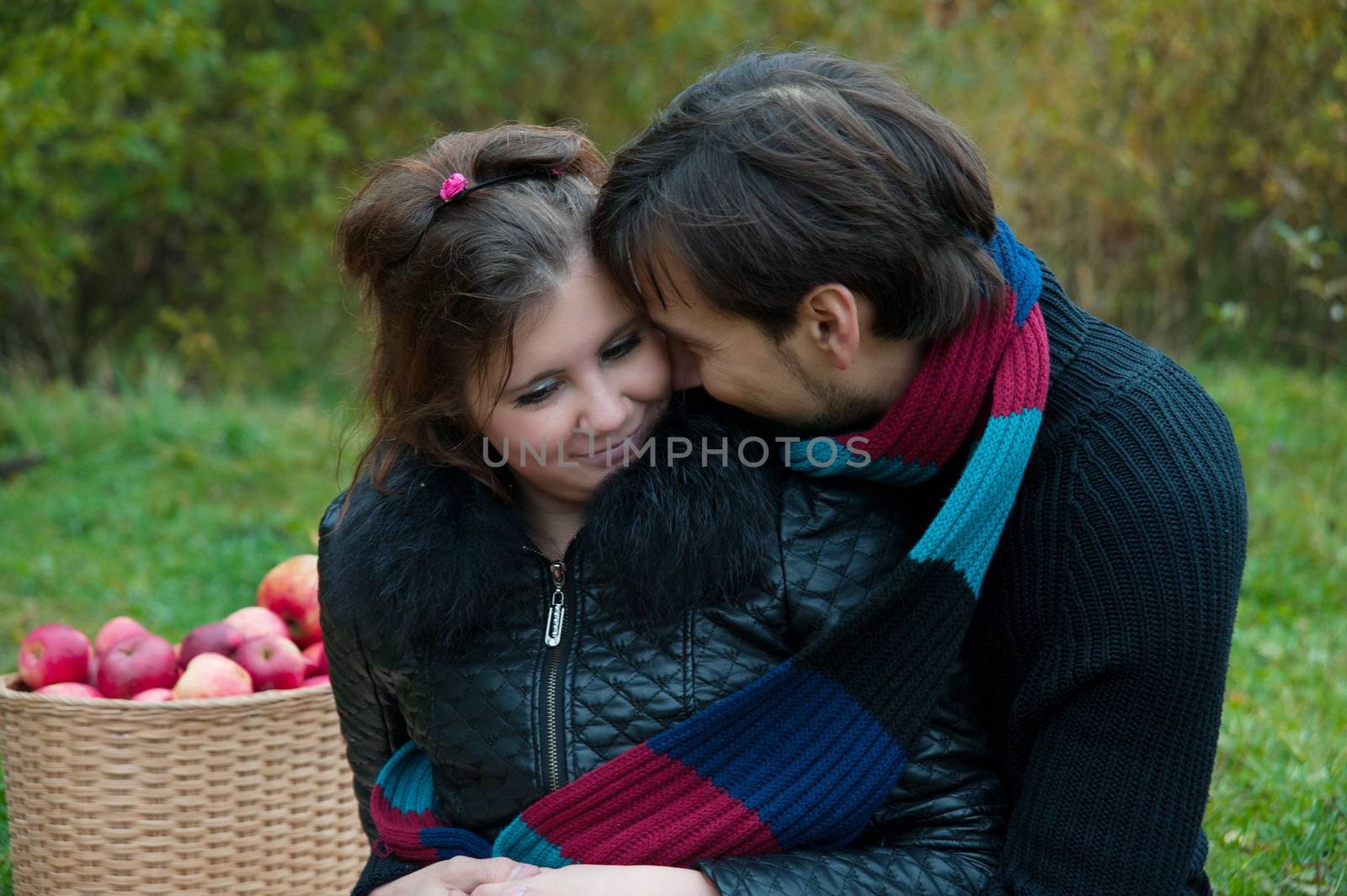 young couple embracing in autumn nature