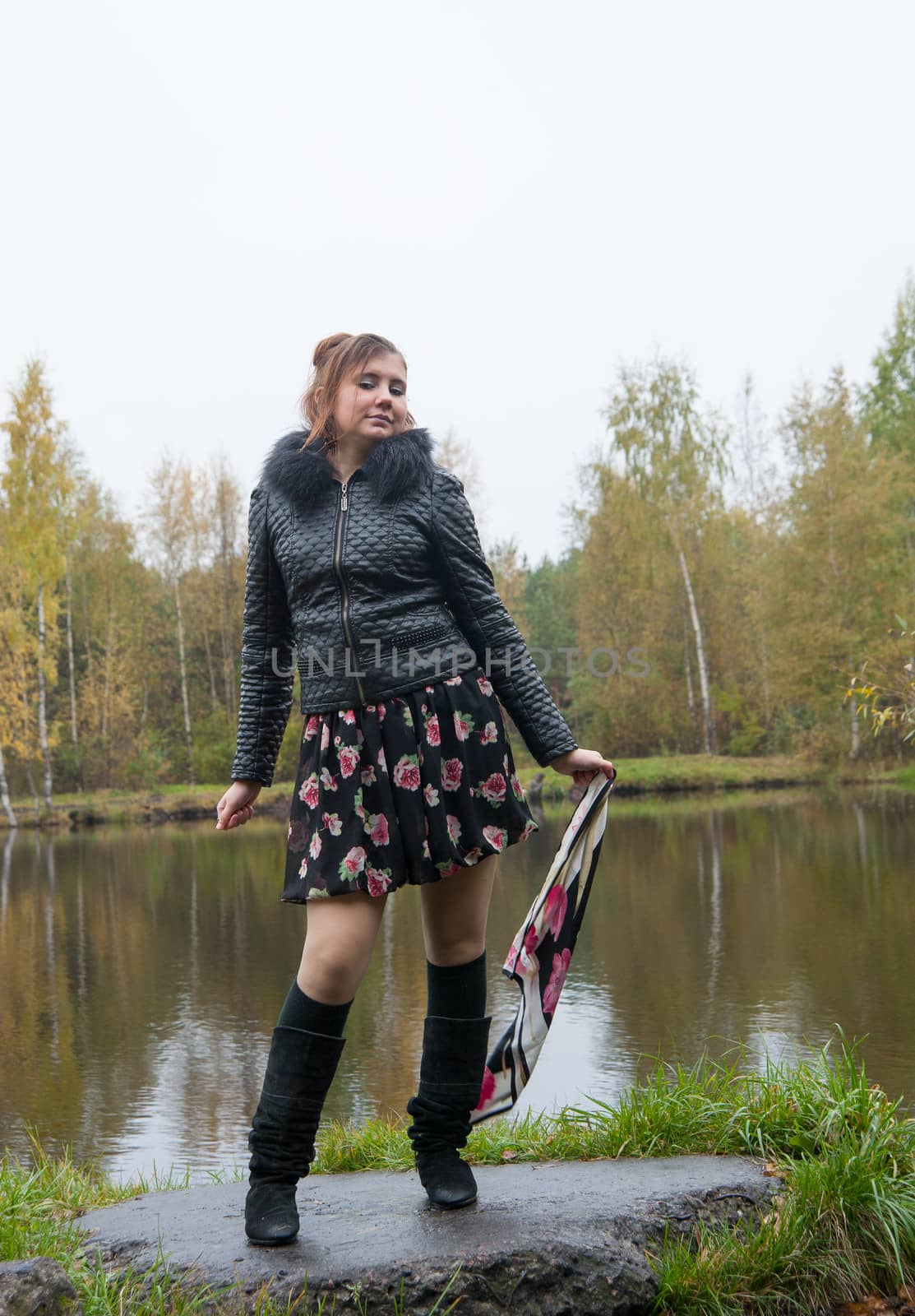 happy woman waving a handkerchief lake