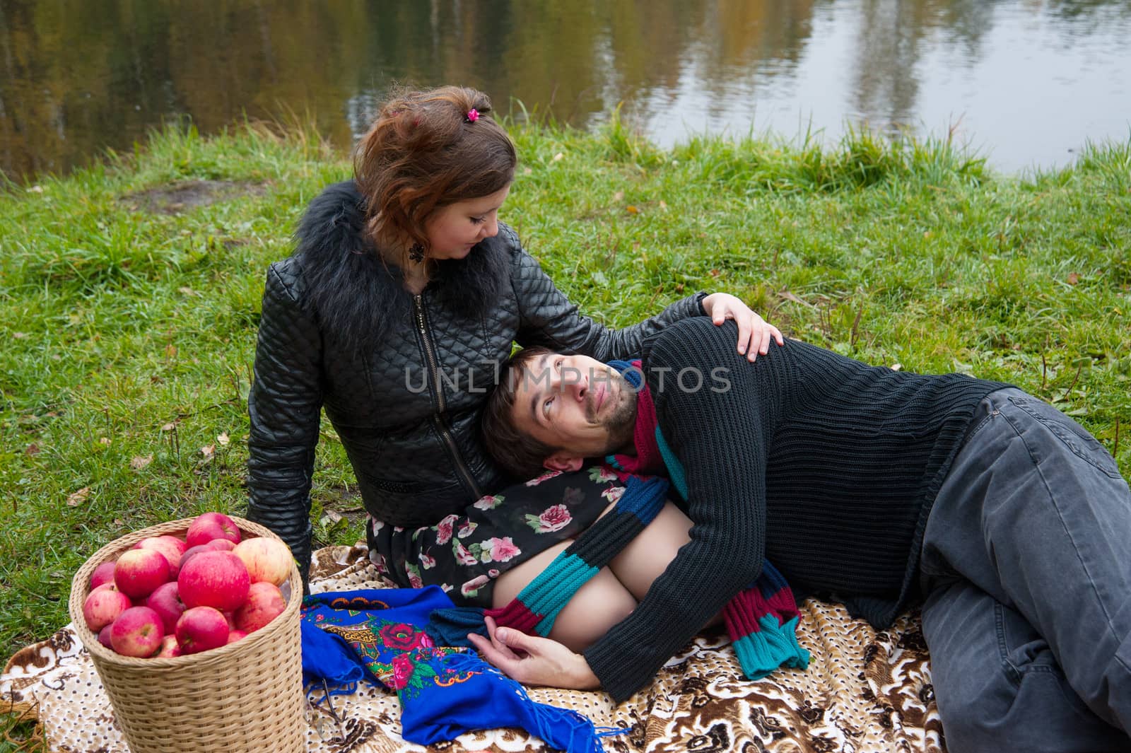 Beautiful loving couple in the Park in autumn picnic