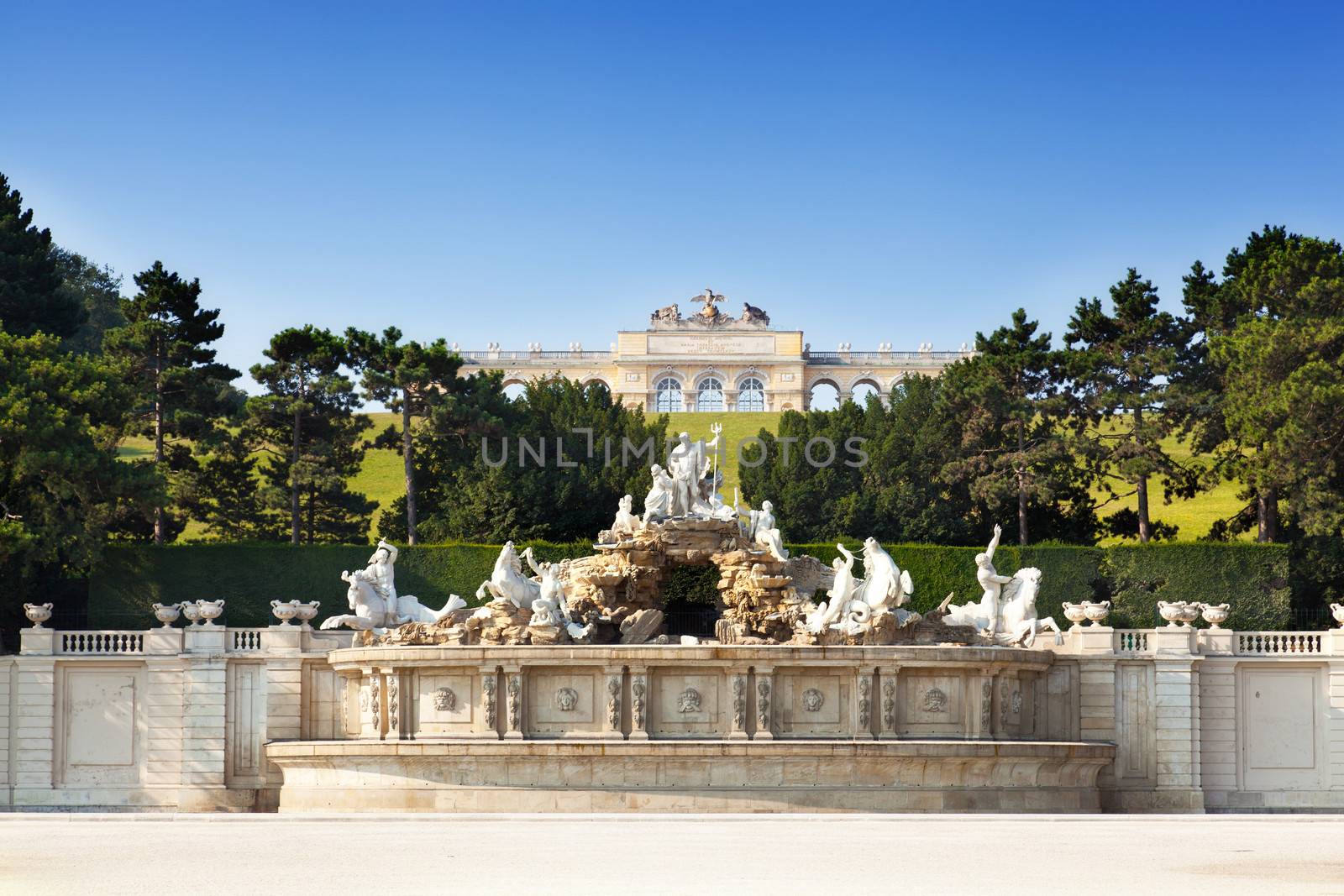 View on Gloriette structure and Neptune fountain in Schonbrunn Palace, Vienna, Austria