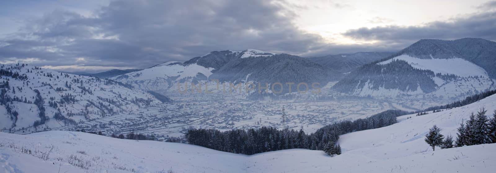 Rural landscape of winter village in Romania