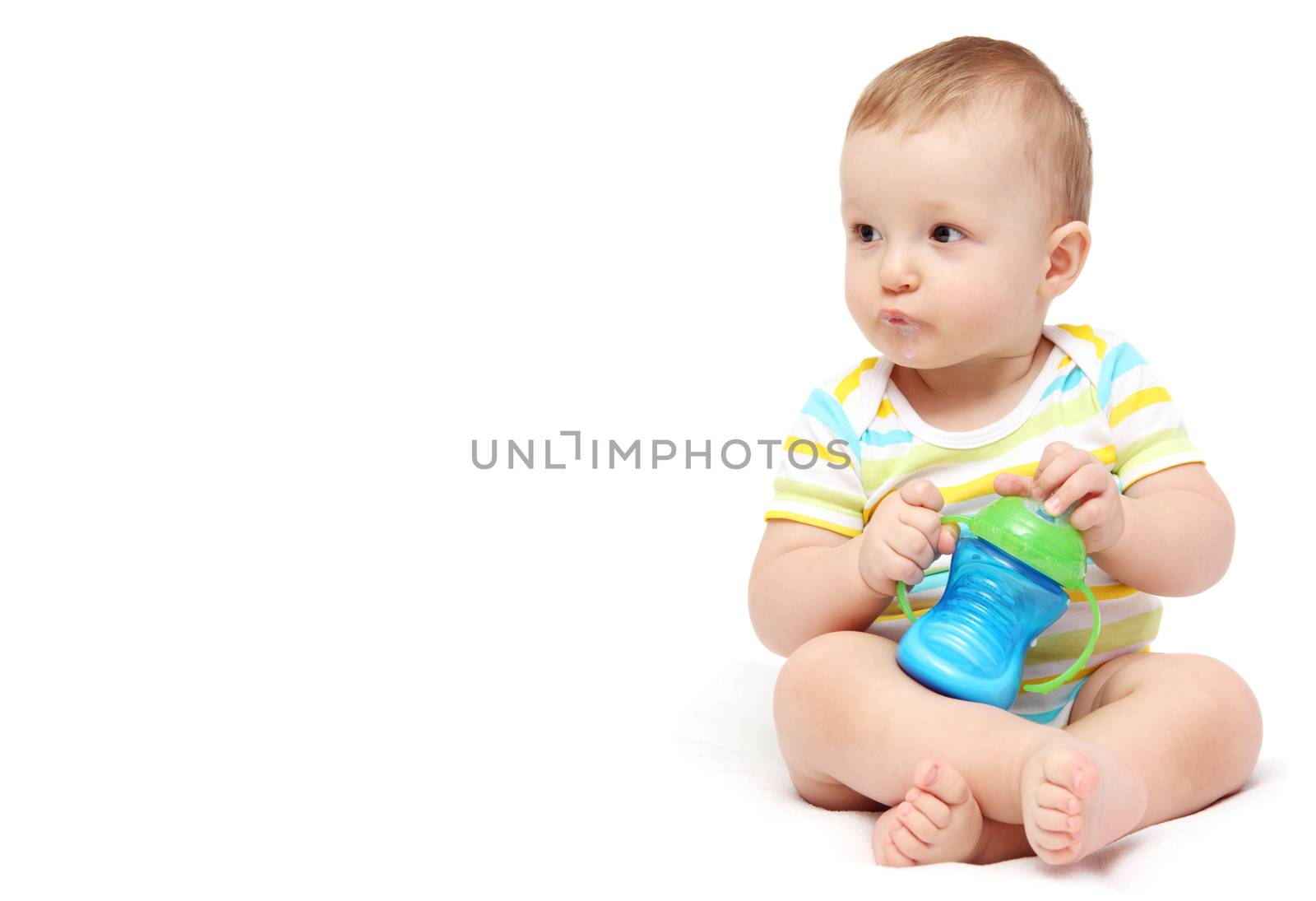 happy baby boy with milk bottle