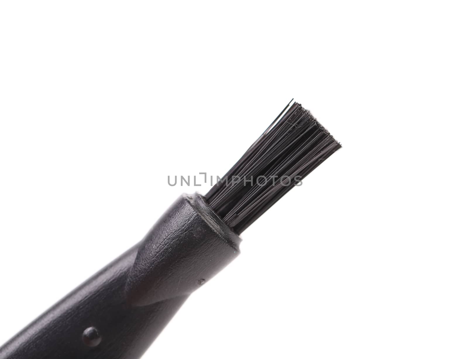 Black plastic brush. Close up. White background.