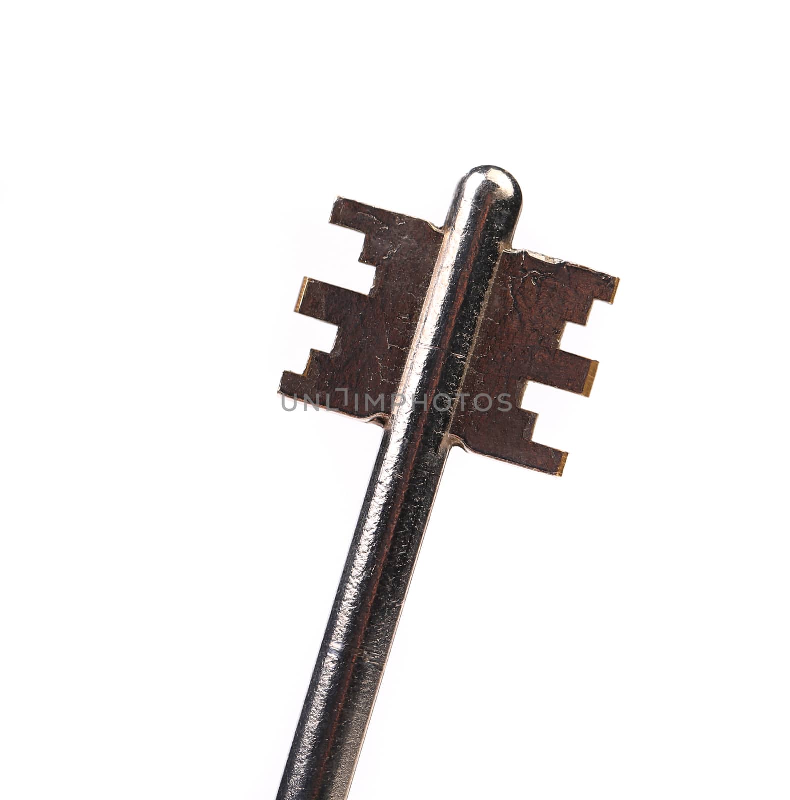 Head of dark steel key. White background.