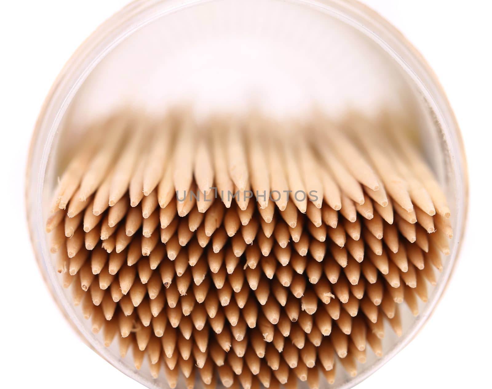 toothpicks in a round box, top view, isolated on white background.
