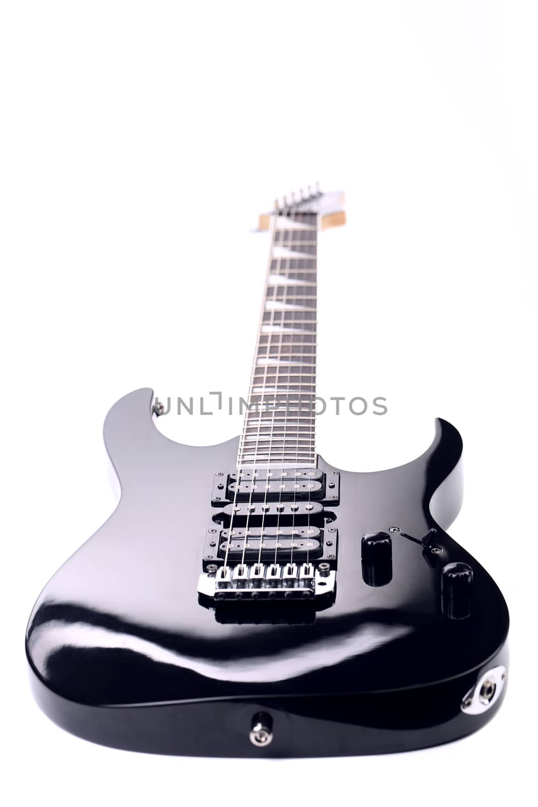 Beautiful black electric guitar isolated over white