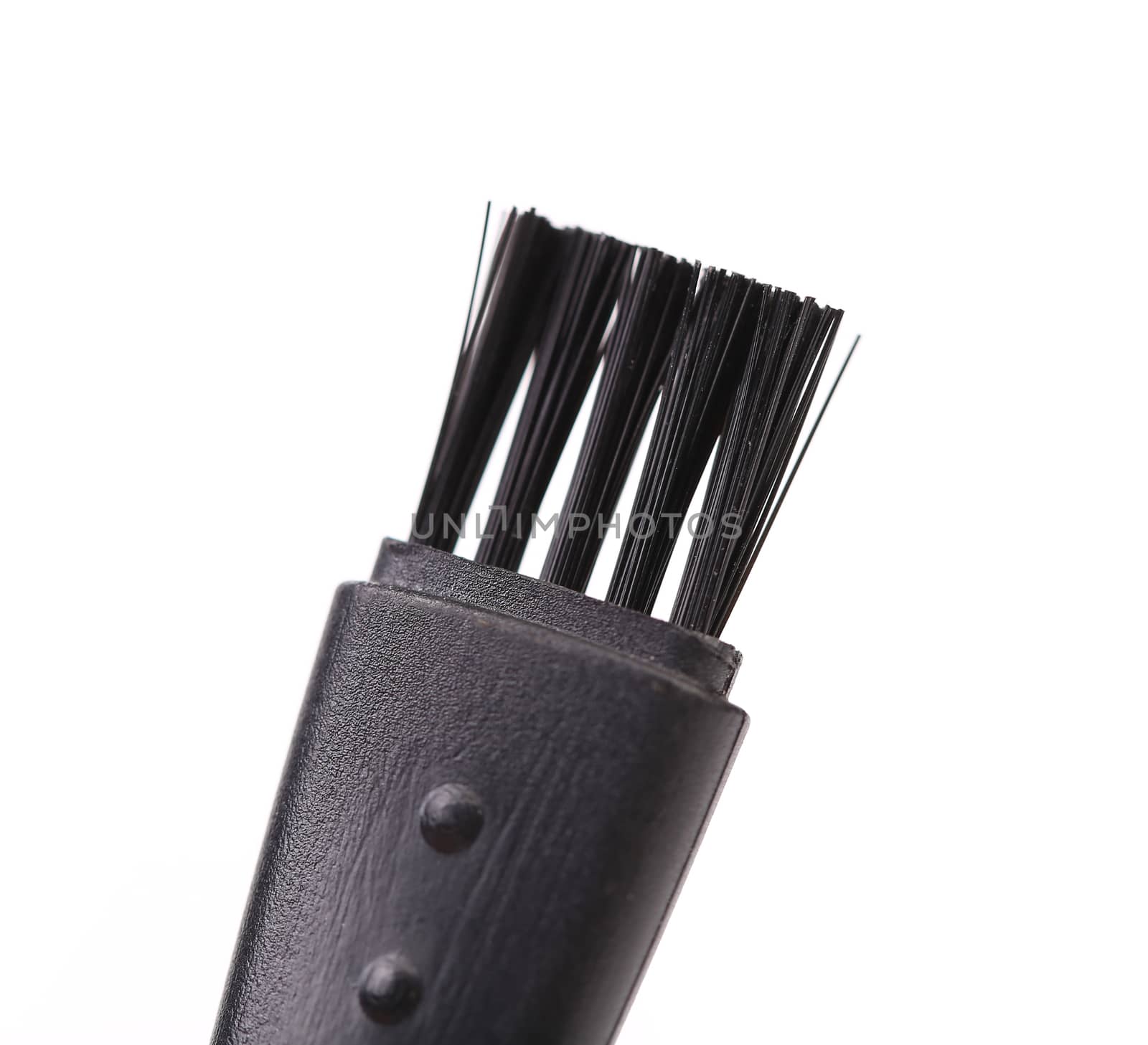 Black plastic brush. Close up. White background.