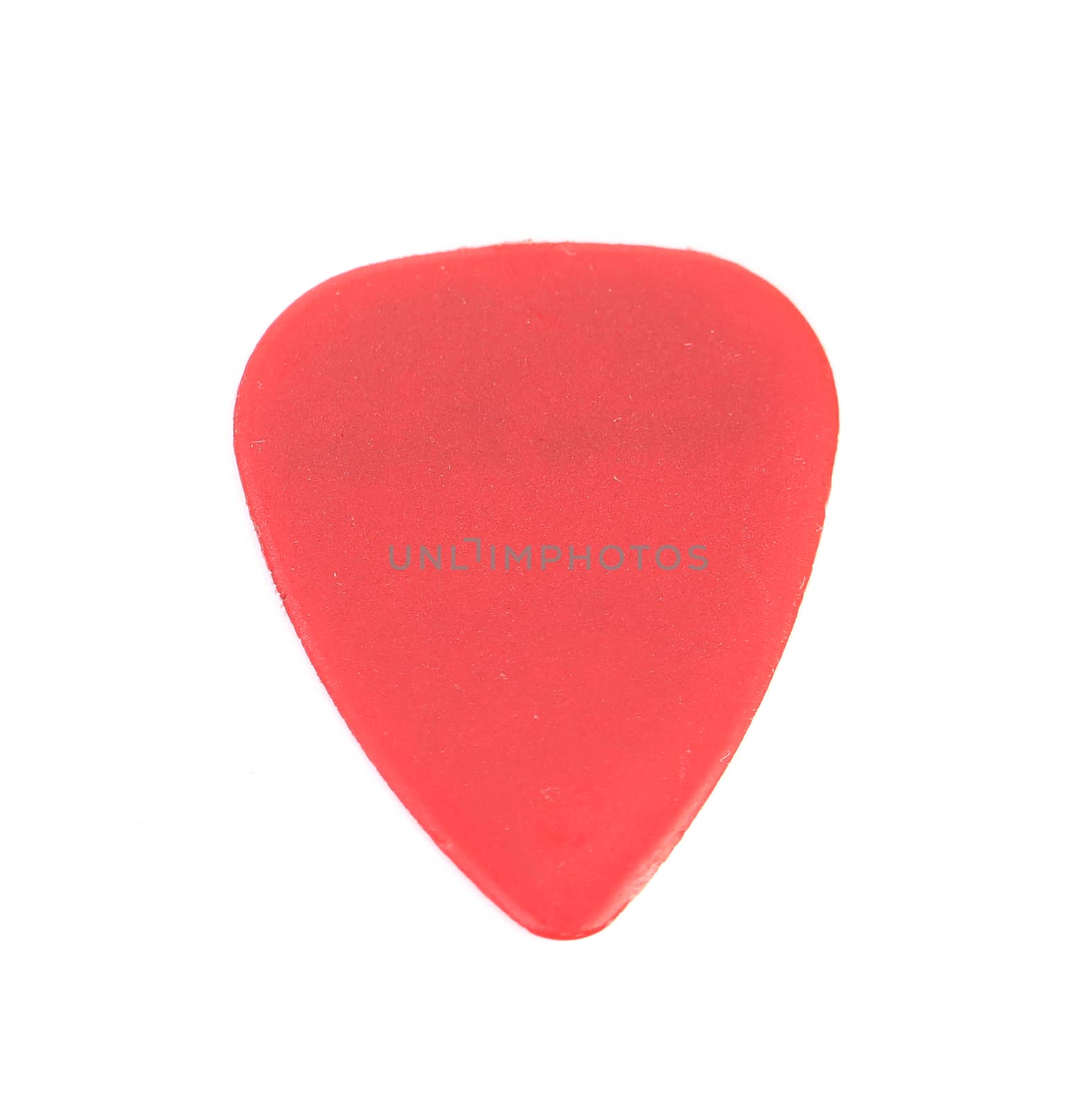 Red plastic guitar plectrum, isolated on white