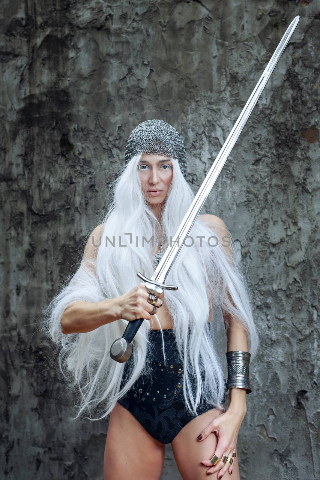 Girl with long white hair in chain mail and sword