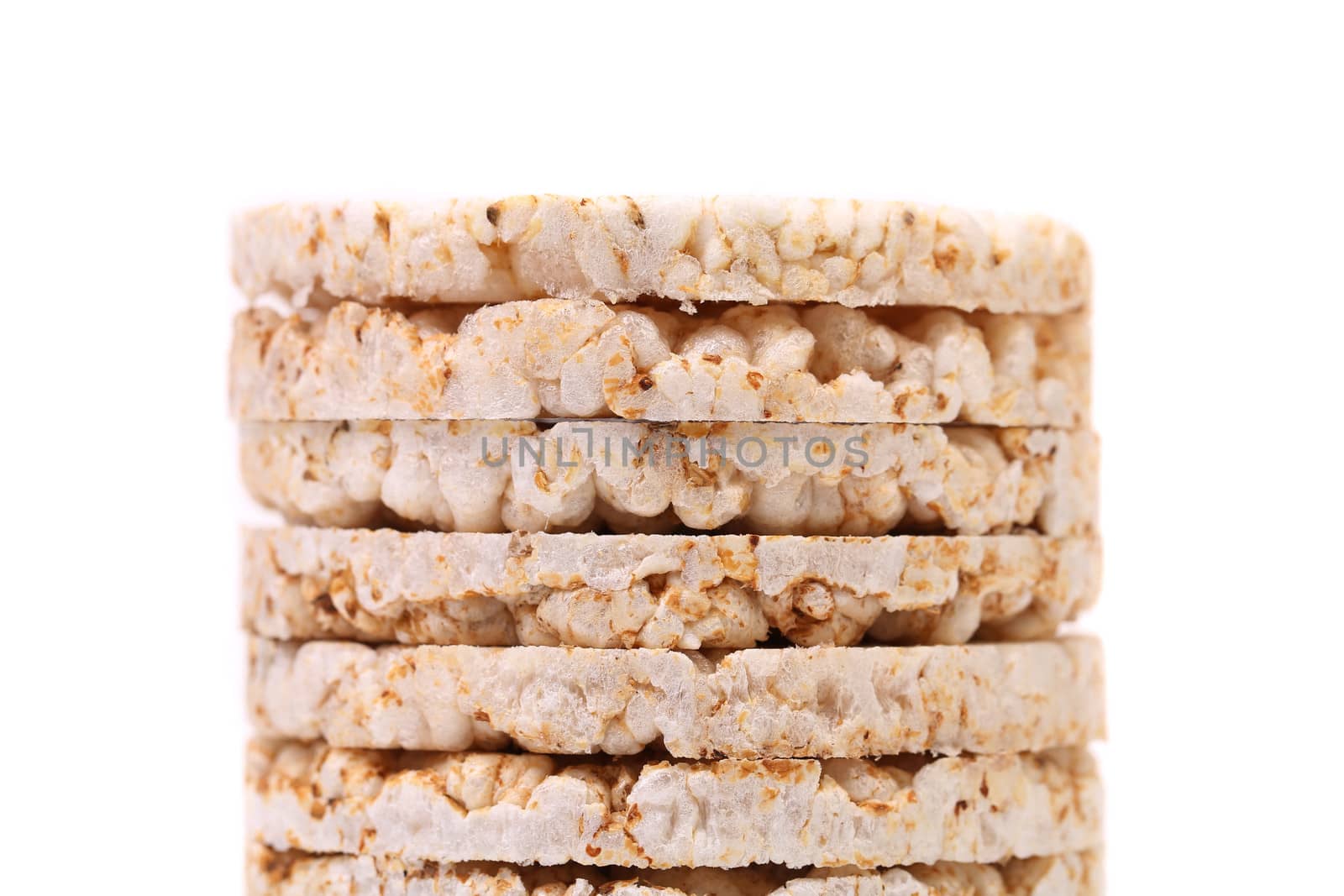 Stack of corn crackers. Close up. White background.