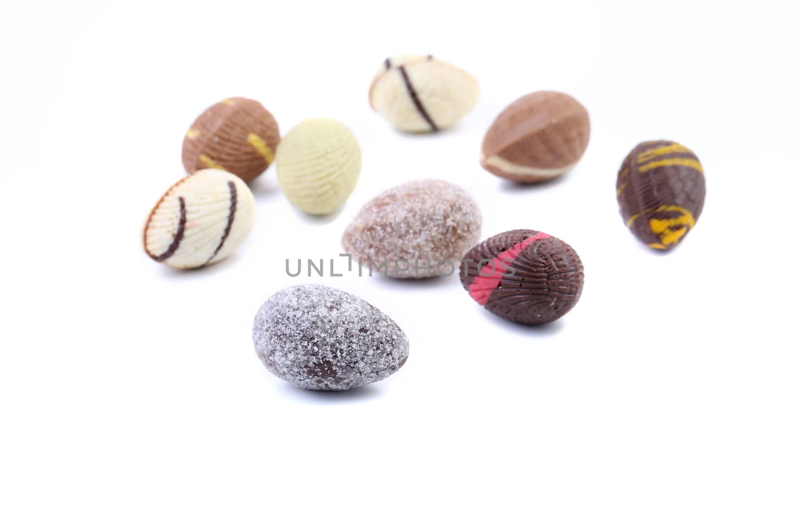 Different chocolate seashells on a white background