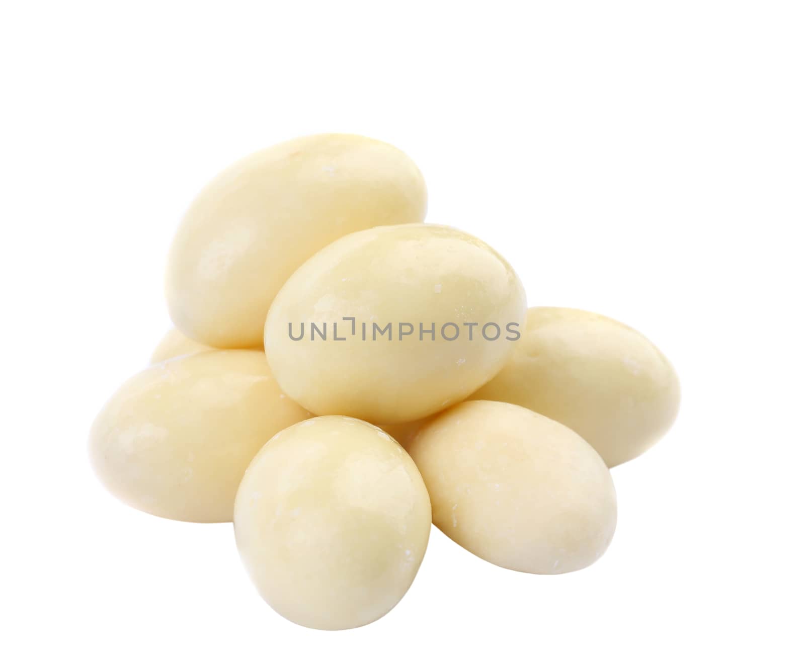 Candy in white chocolate isolated on a white background.