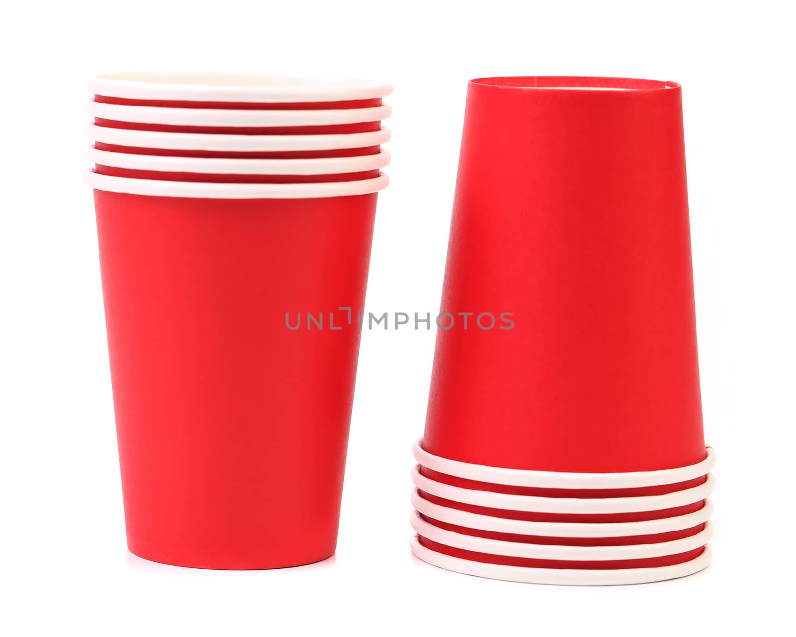 Pile of colorful paper coffee cup. Close up. White background.