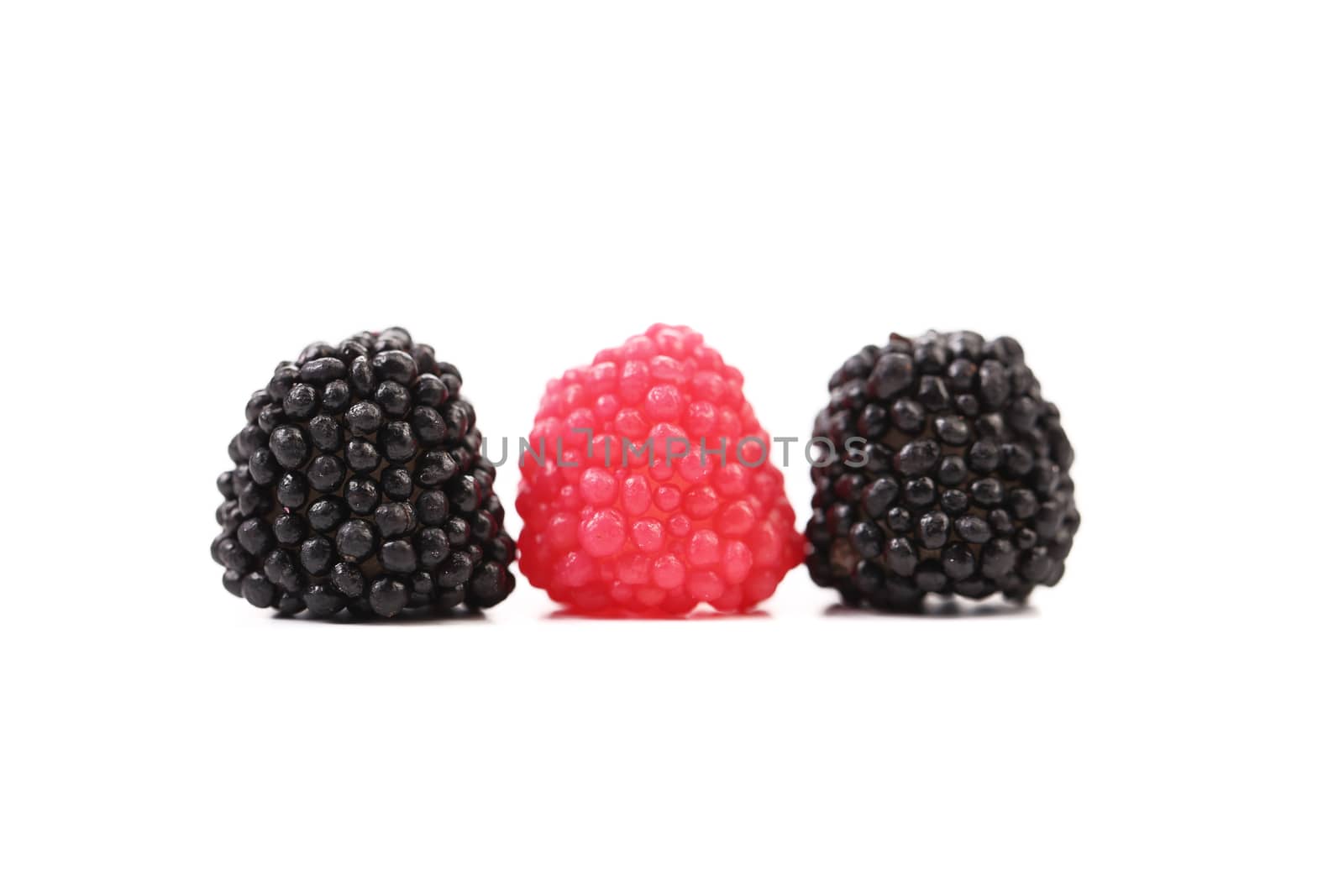 Three jujube colored balls on a white background