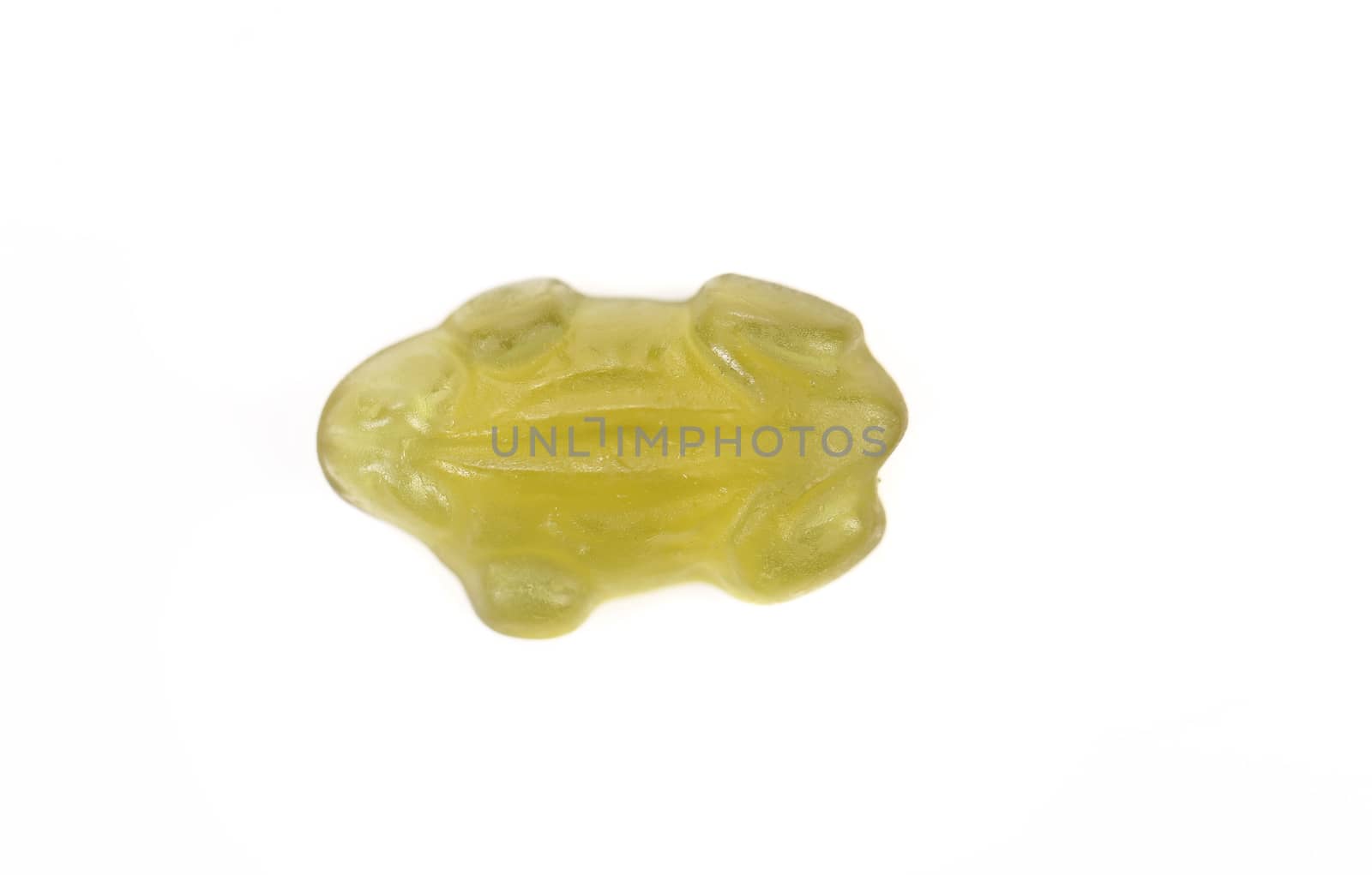 Fruit jelly in form of green frog. Isolated. Close up. White background.