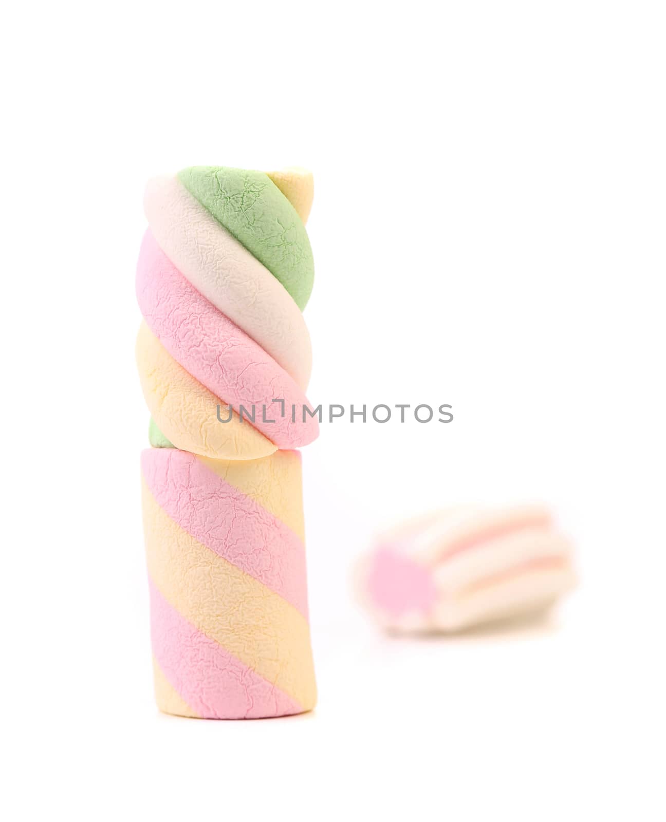 Three different colorful marshmallow. Close up. White background.