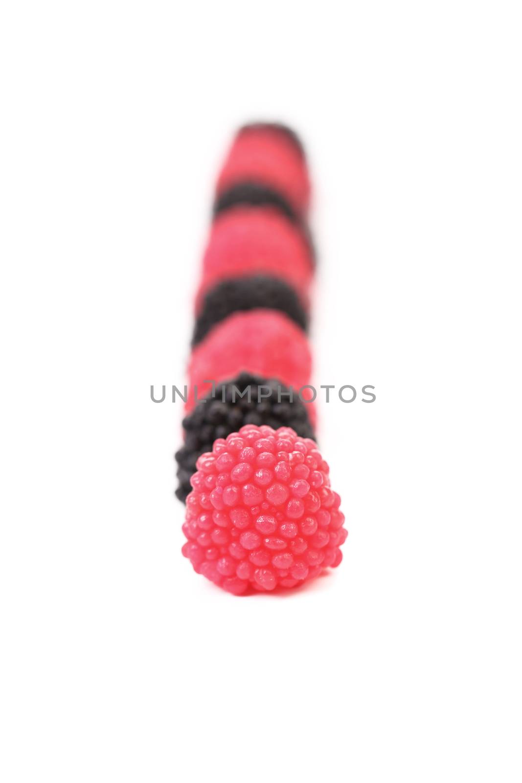 Fruit jelly in form of berries candy on white background
