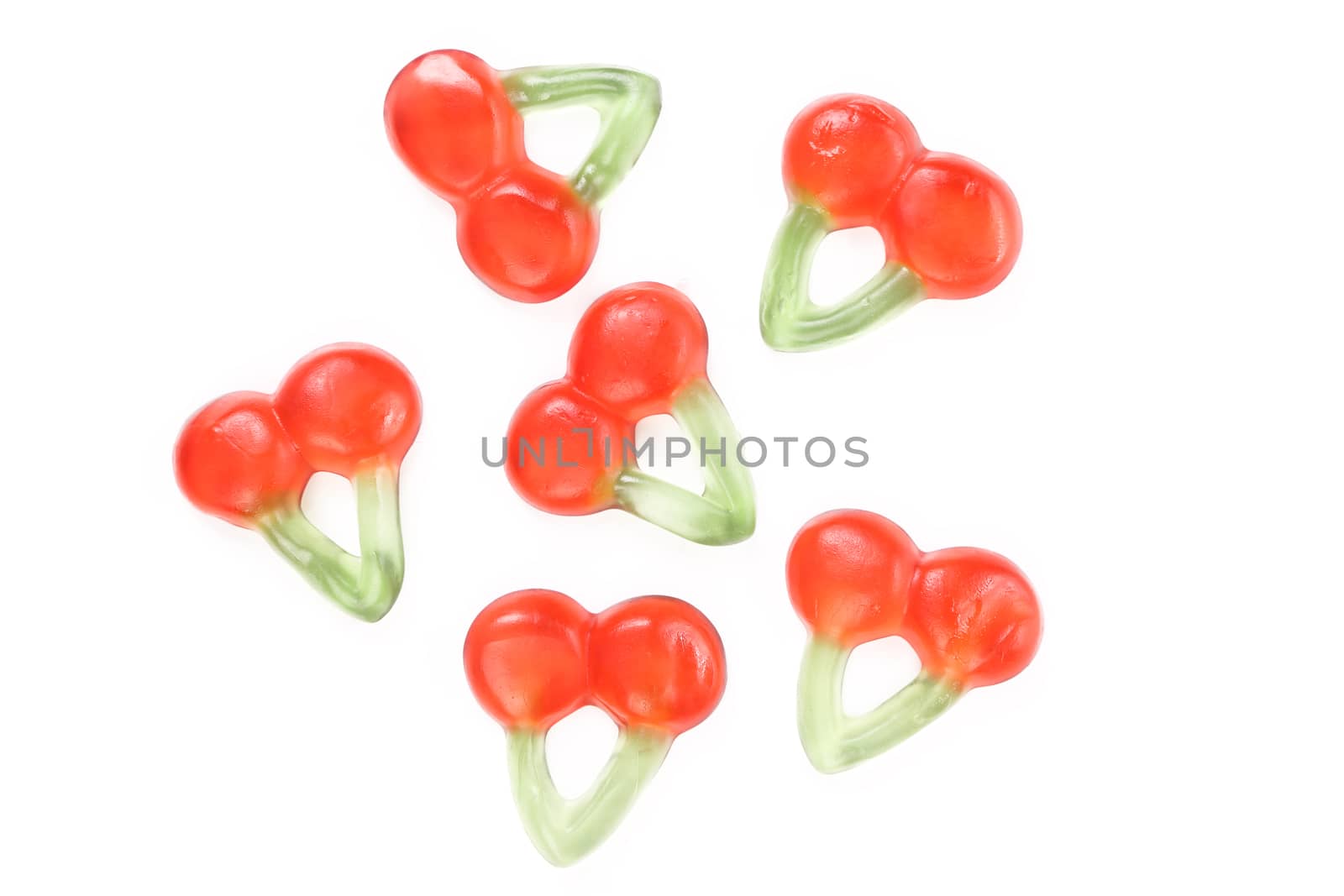 Fruit jelly in form of cherries. White background.