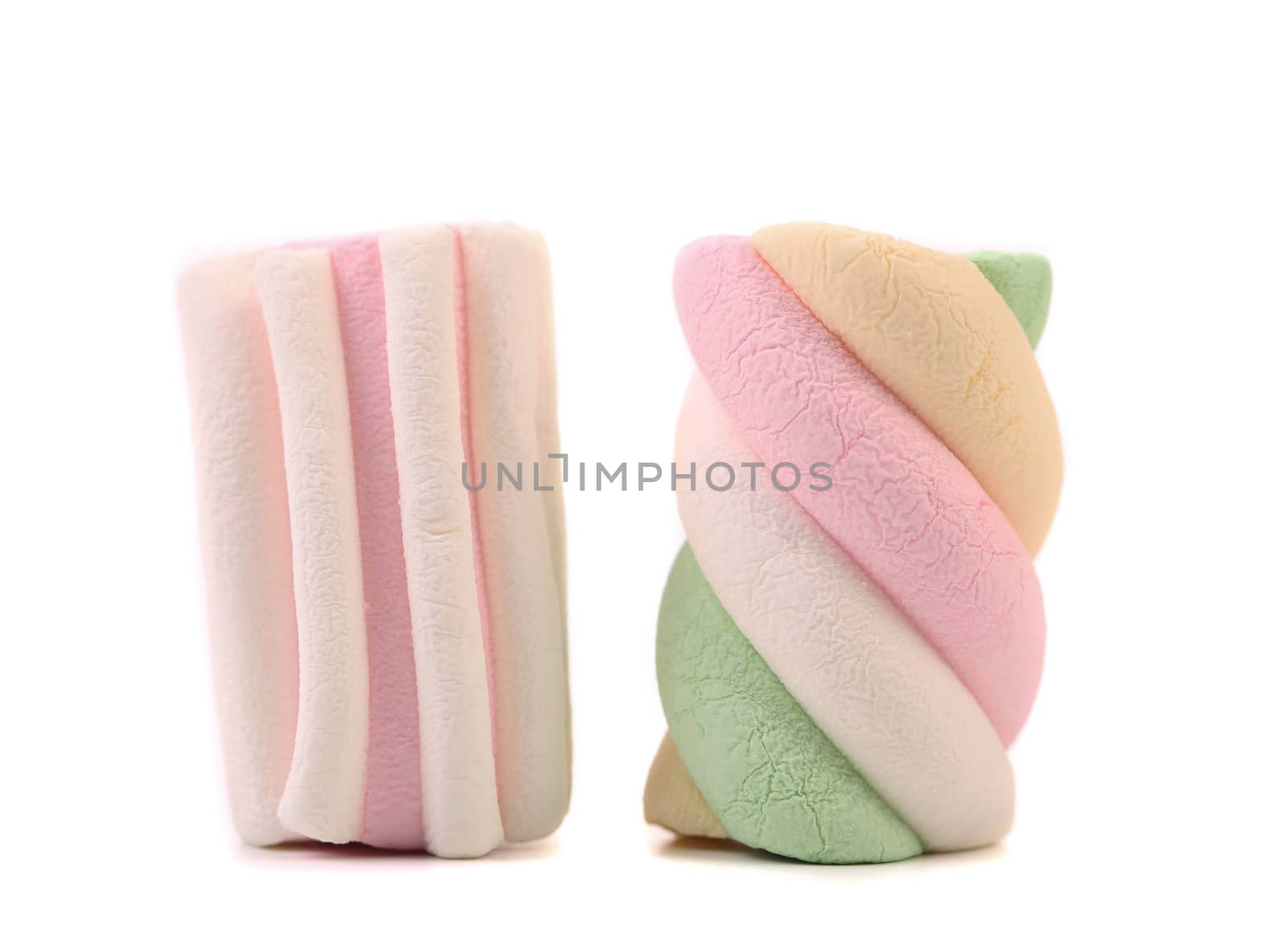 Two colourful marshmallow. Close up. White background.