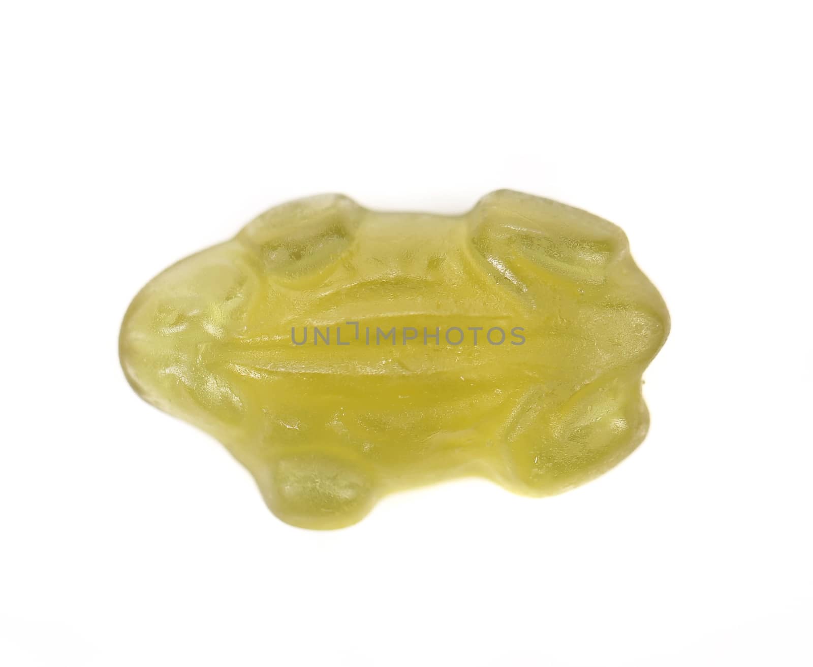 Fruit jelly in form of frog. White background.