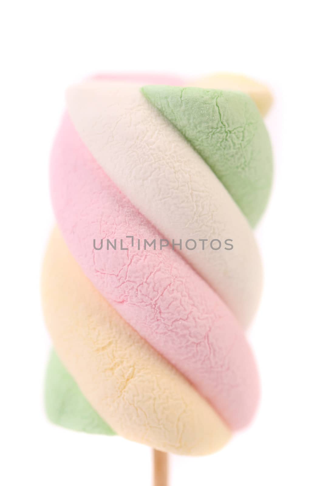 One colourful marshmallow on a stick. Close up. White background.