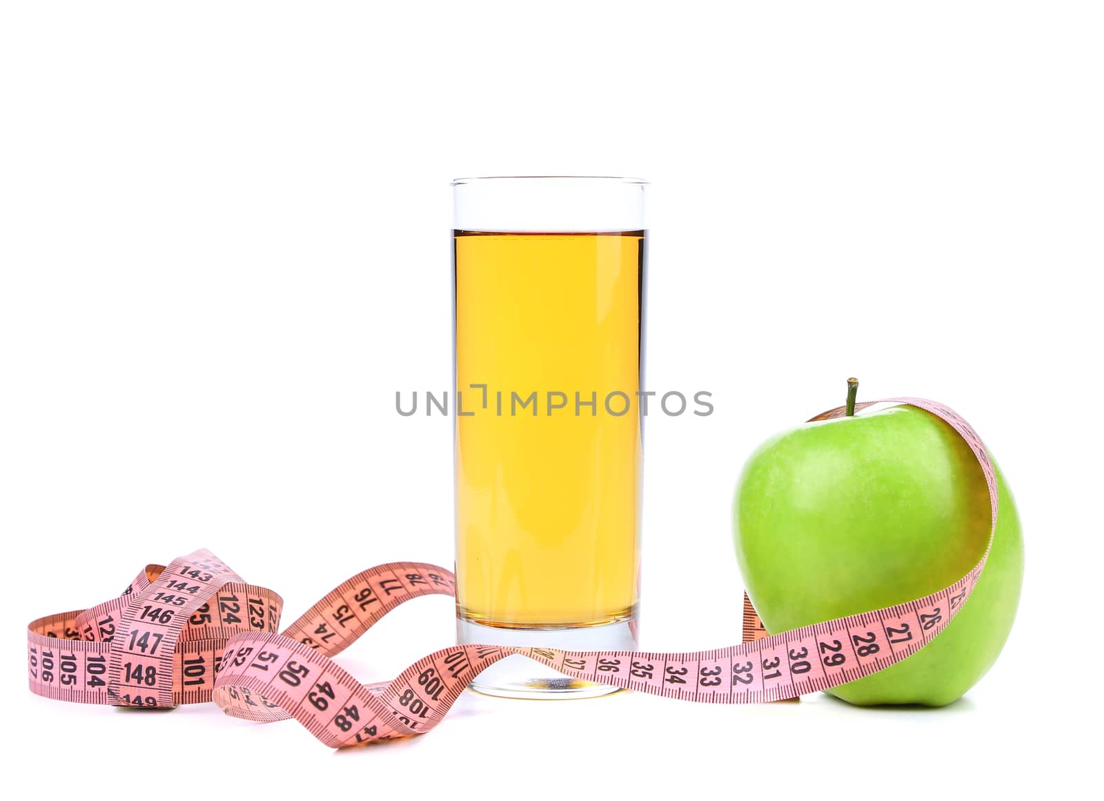 Juice and green apples measured the meter. White background.