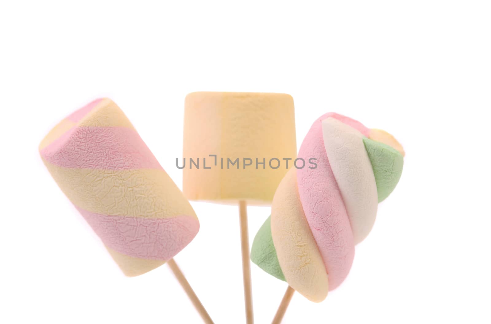 Three different marshmallow on a sticks. White background.