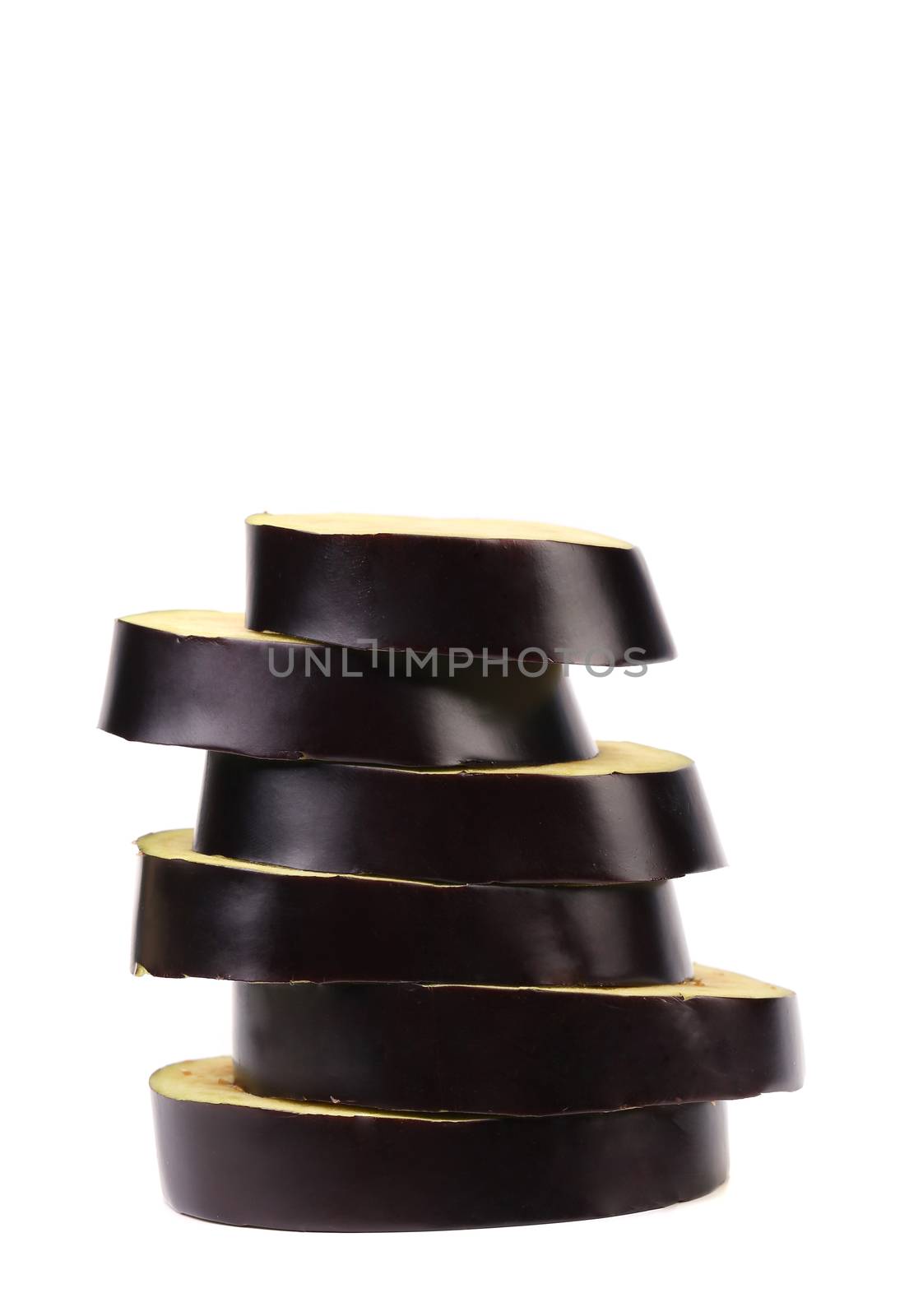 Stack of slices black eggplant. White background.