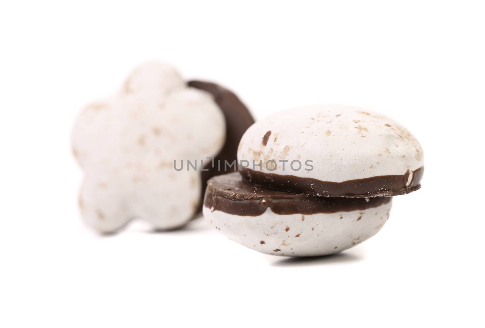 Several different chocolate meringues. Close up. White background.