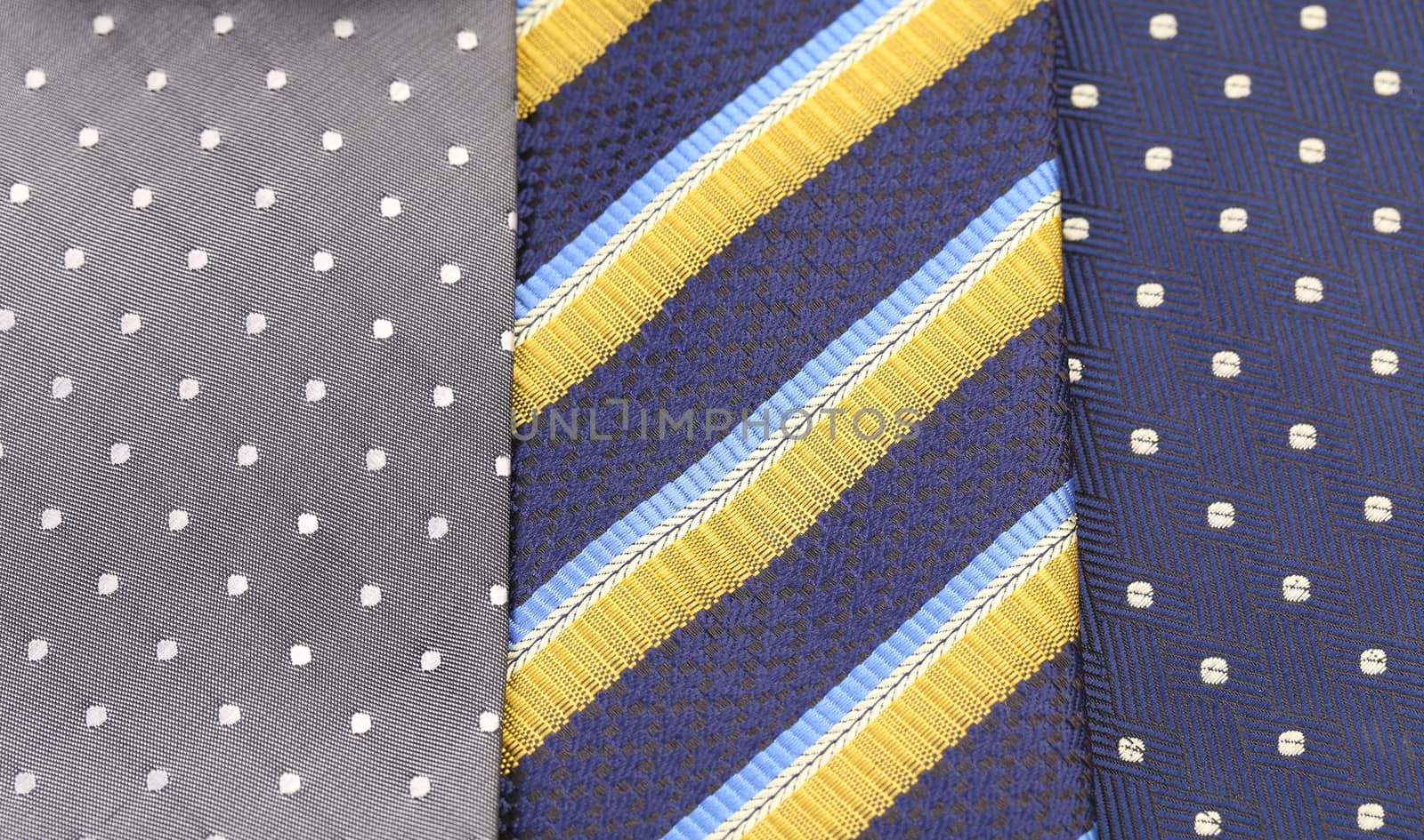 Background of three  multi-colored tie. Half background.