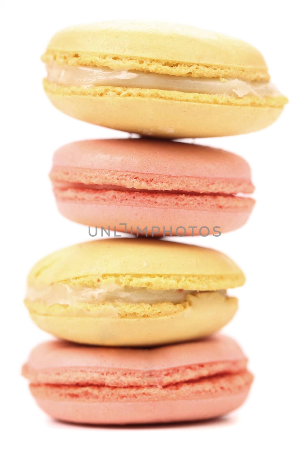 Stack of macaron cakes. Close up. White background.