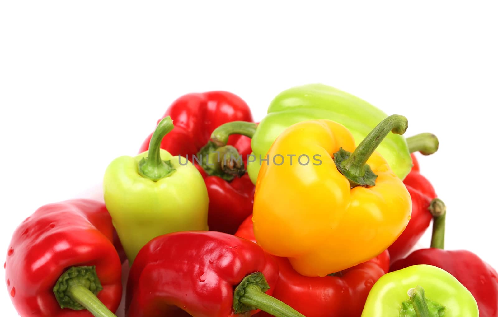Multi-colored peppers on a white background. Close up.
