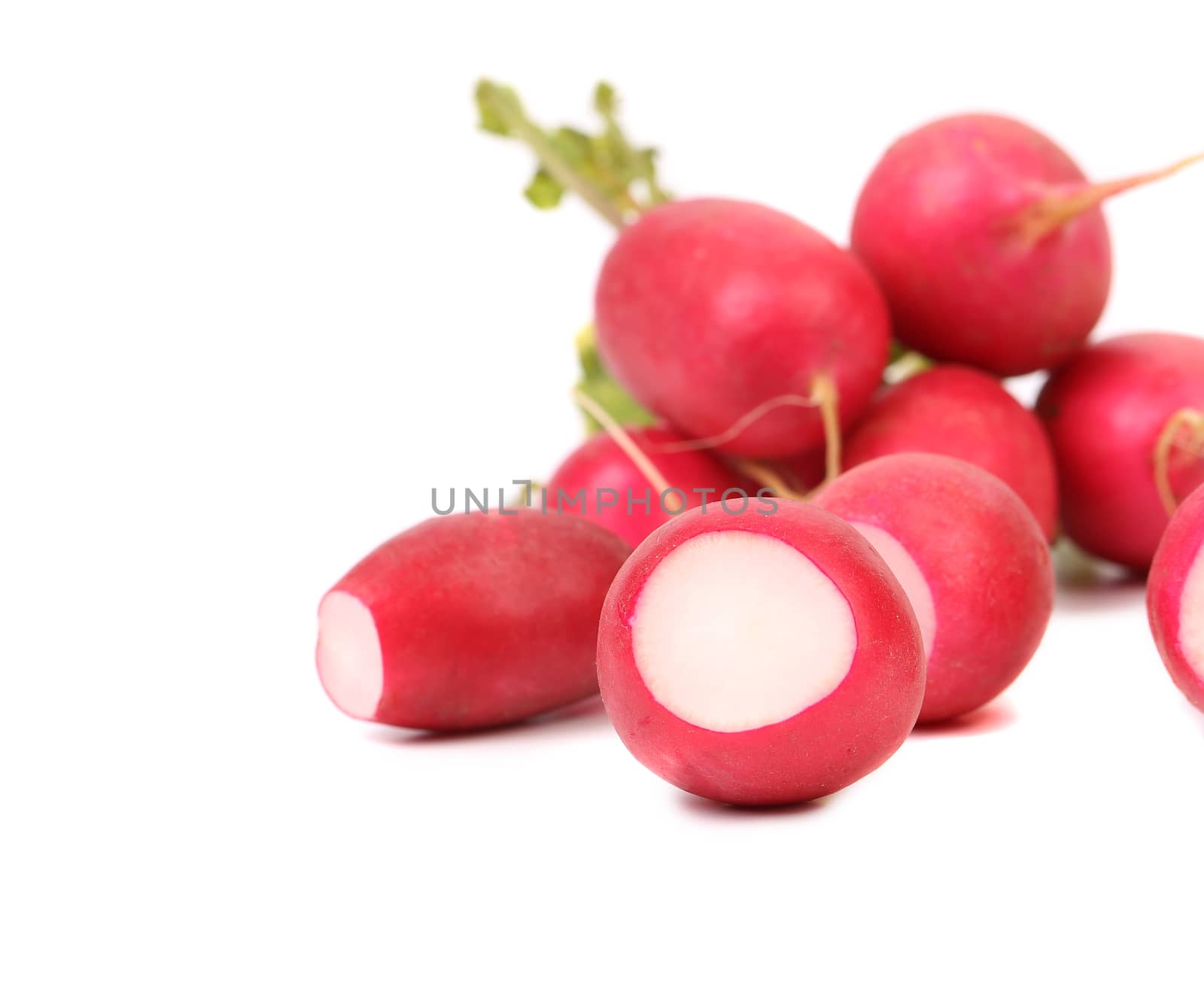 Small garden radish and slices isolated on a white background.