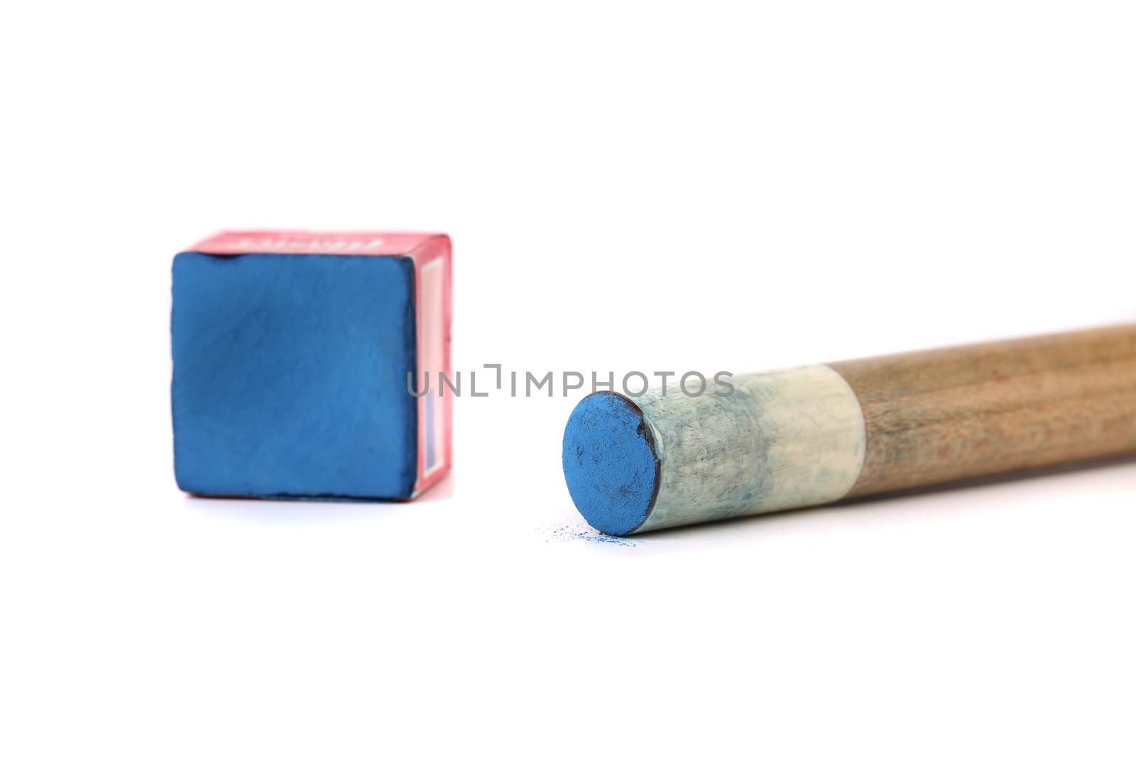 Cue stick with chalk block. White background.