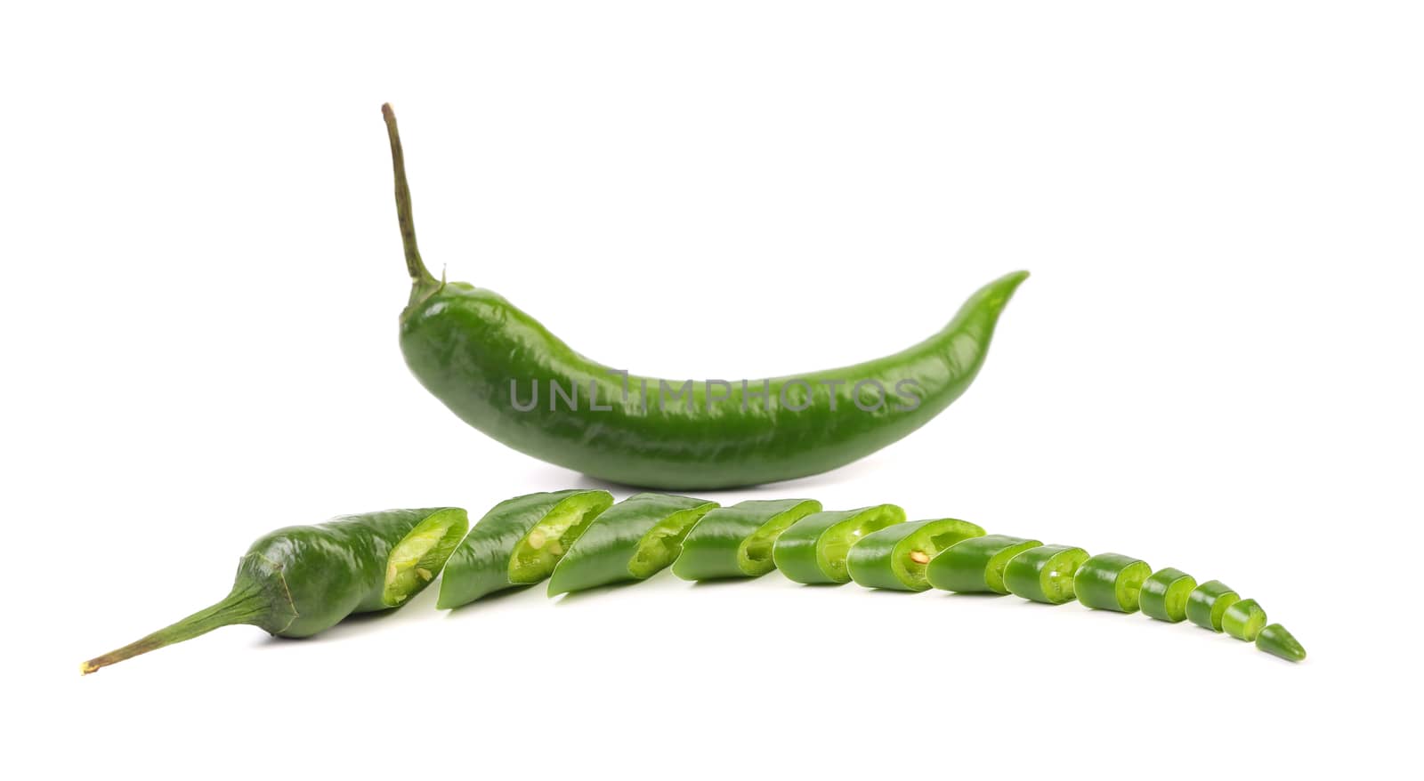 Green chili pepper and slices isolated on a white background
