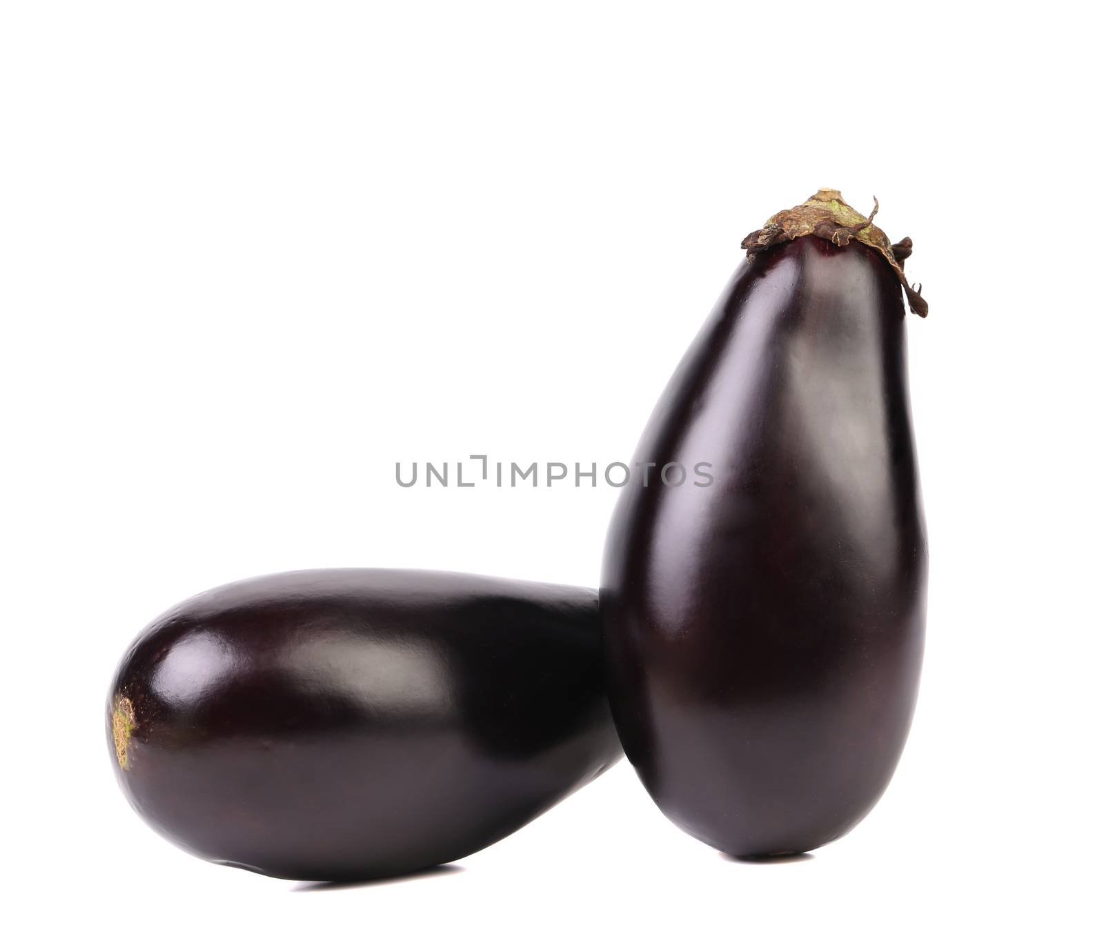Two black eggplants isolated on a white background.
