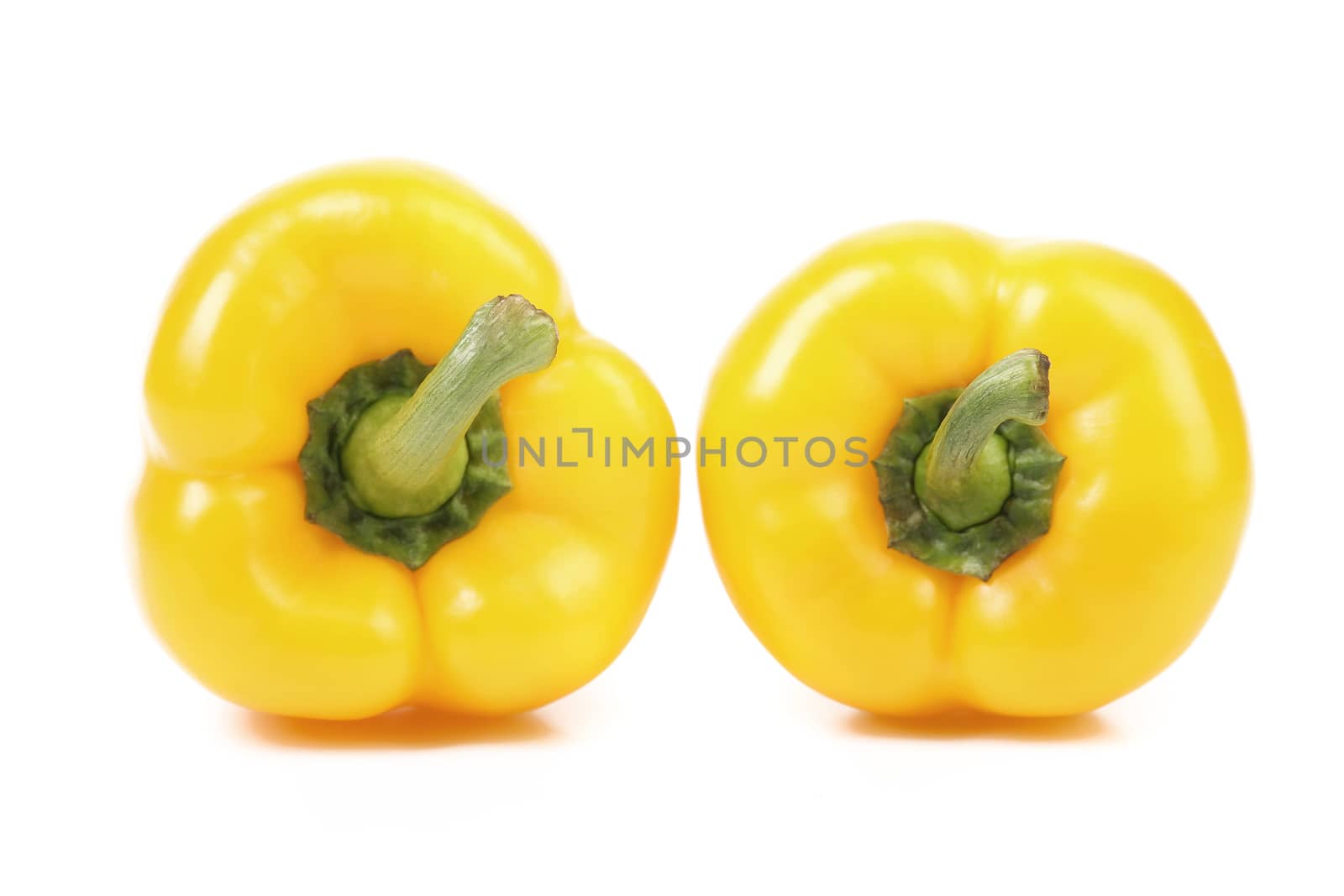 Yellow peppers isolated on a white background.