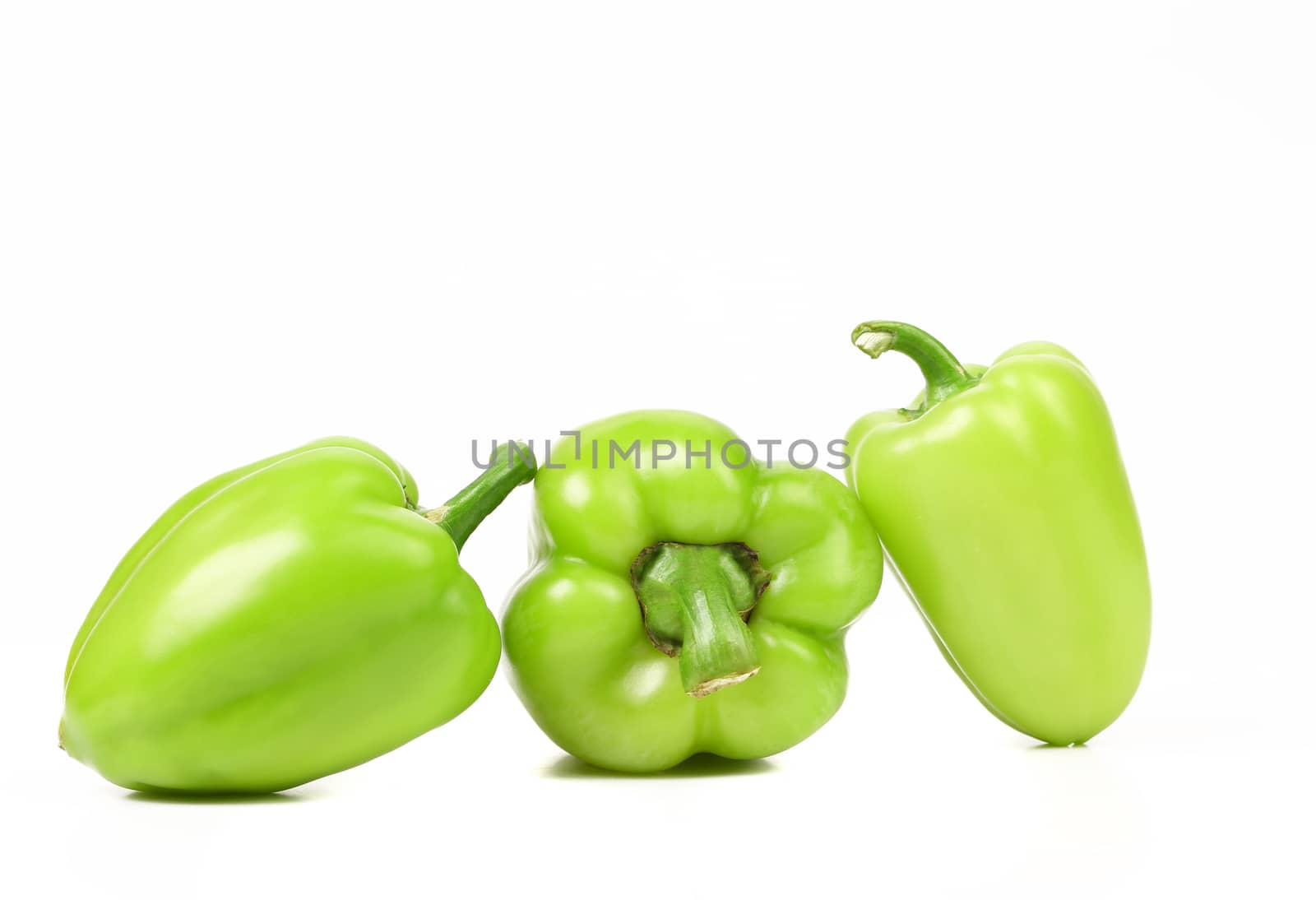 Green peppers isolated on a white background.