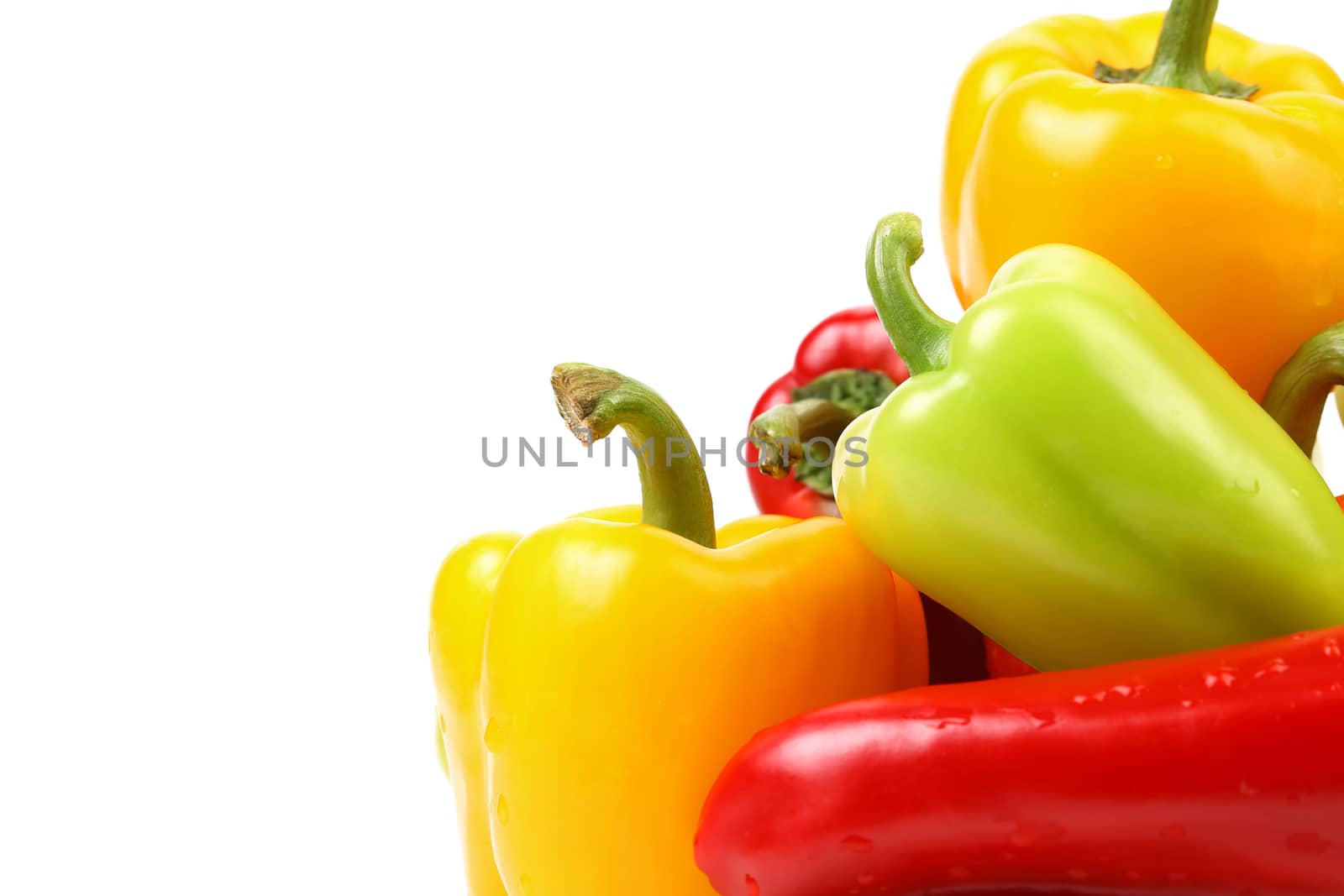 Multi-colour peppers on a white background. Close up.