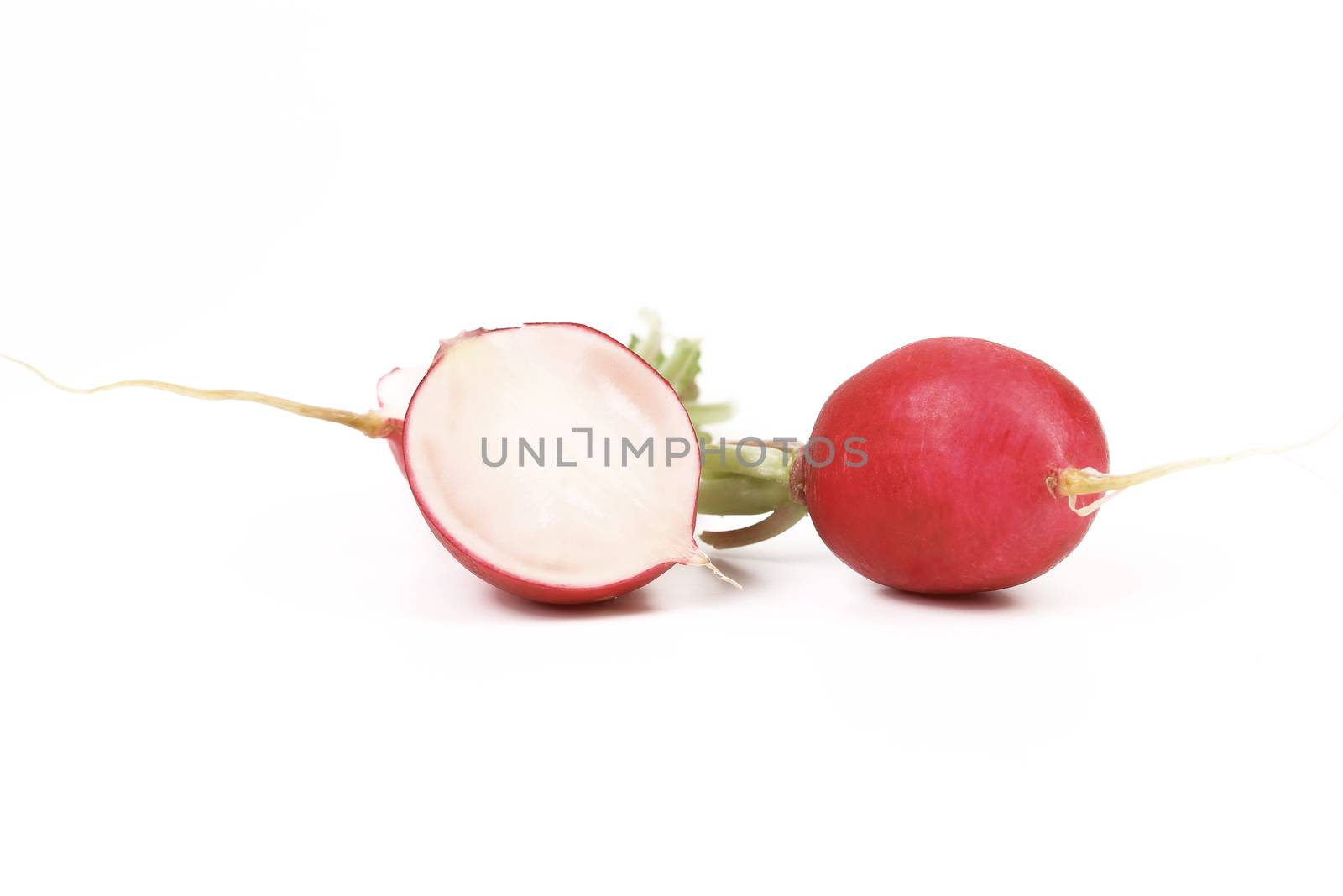 Red radish and slice. Isolated on a white background