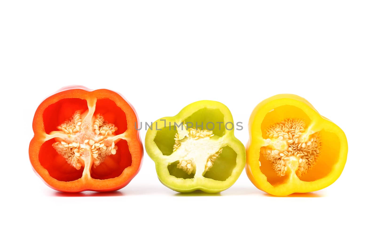 Three half of bell pepper on white background
