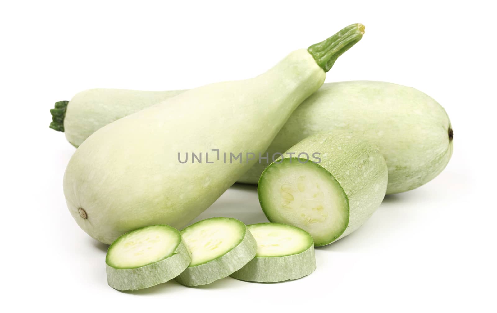 Fresh marrow vegetable and slices. White background.