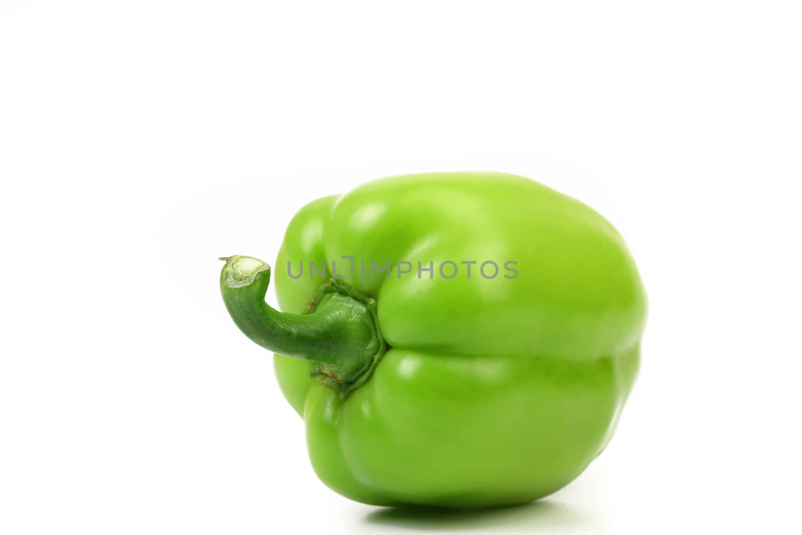 Green pepper with tail on a white background.